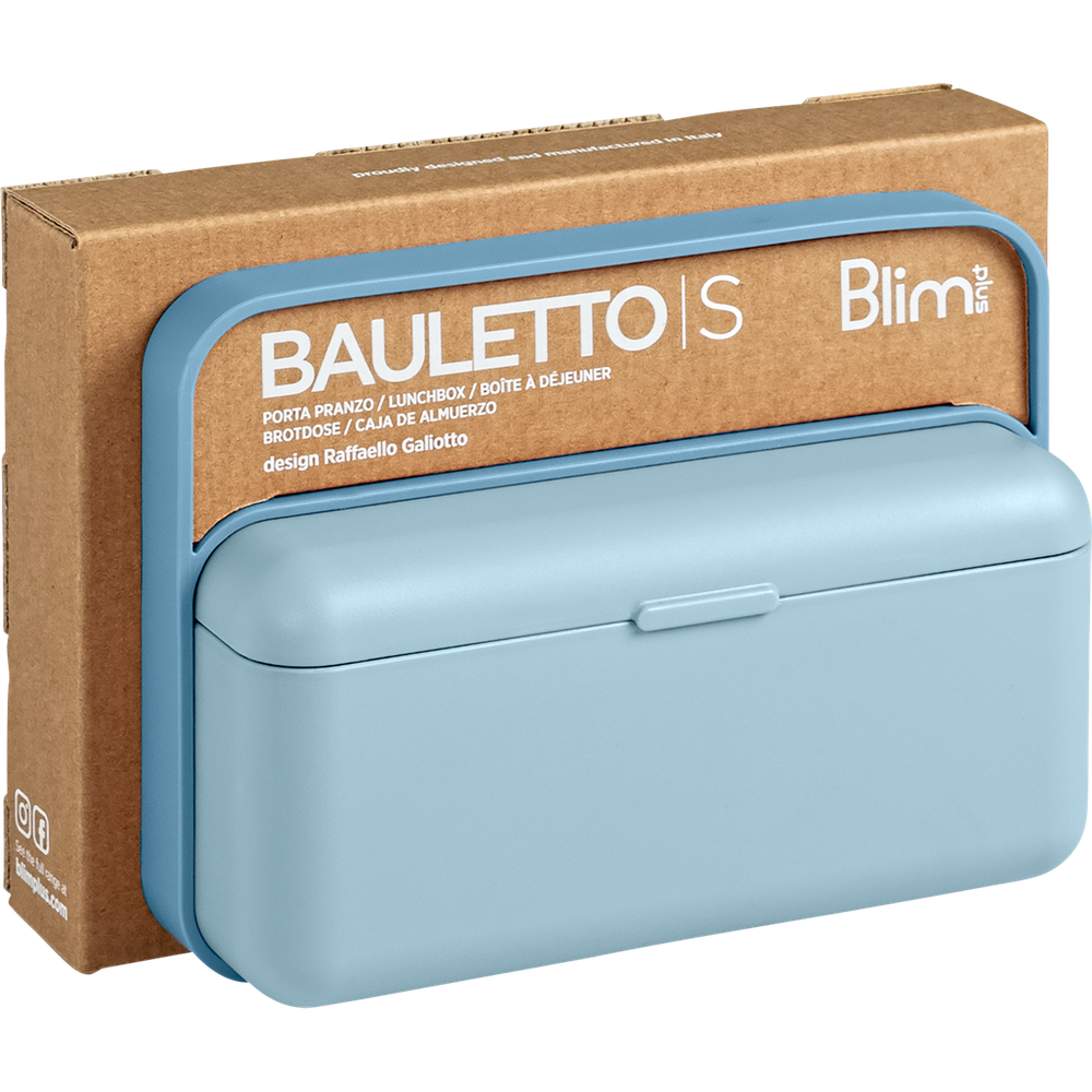 Porta pranzo azzurro 'Bauletto S' davanti a una scatola di cartone.