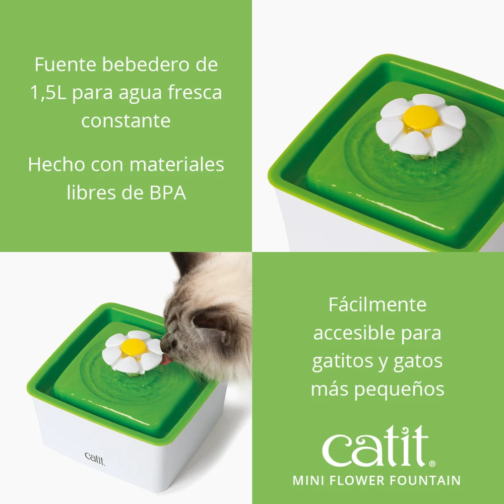Un gato blanco y verde bebe agua de una fuente de agua con forma de flor.