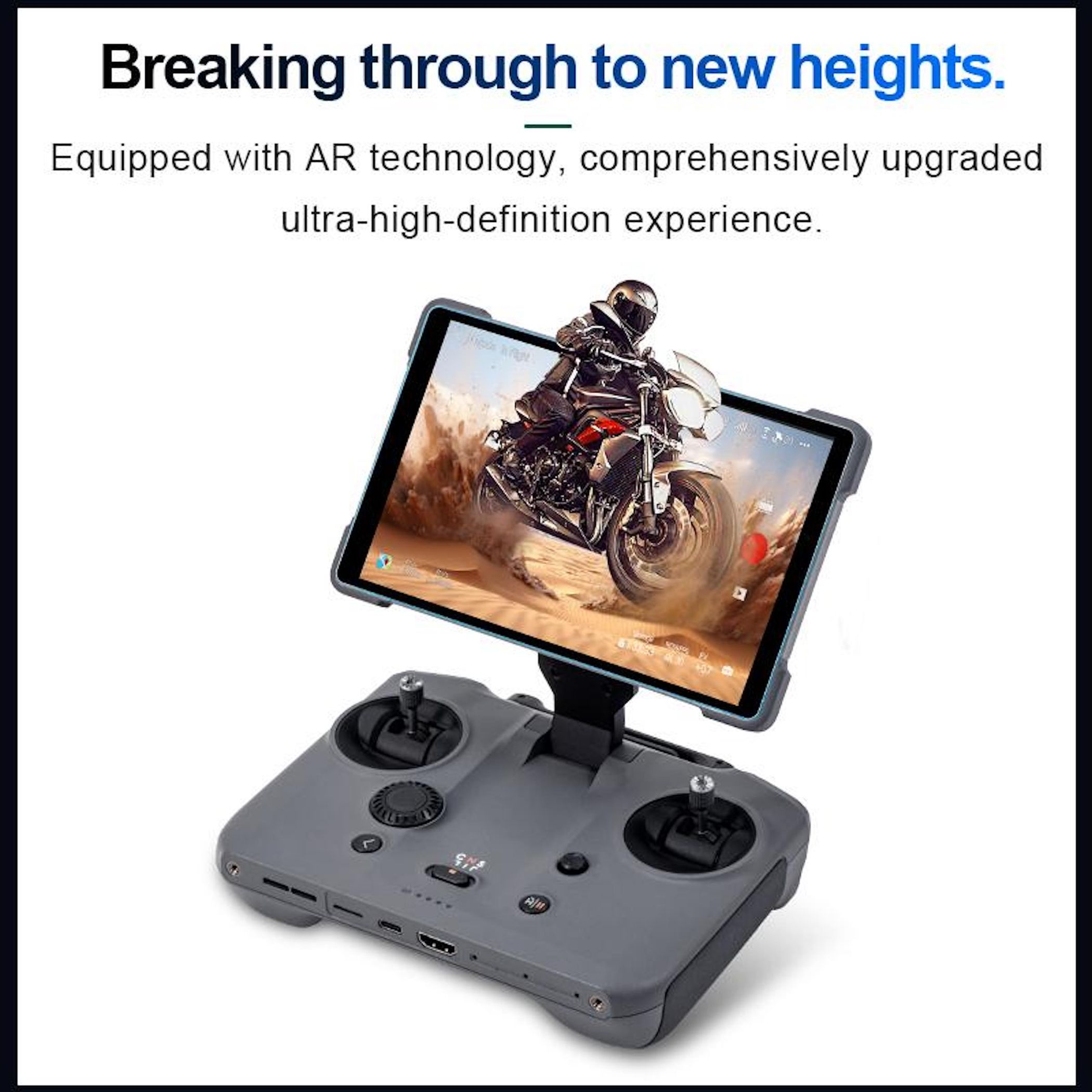 Controller per drone grigio con tablet montato che mostra un motociclista nel deserto.