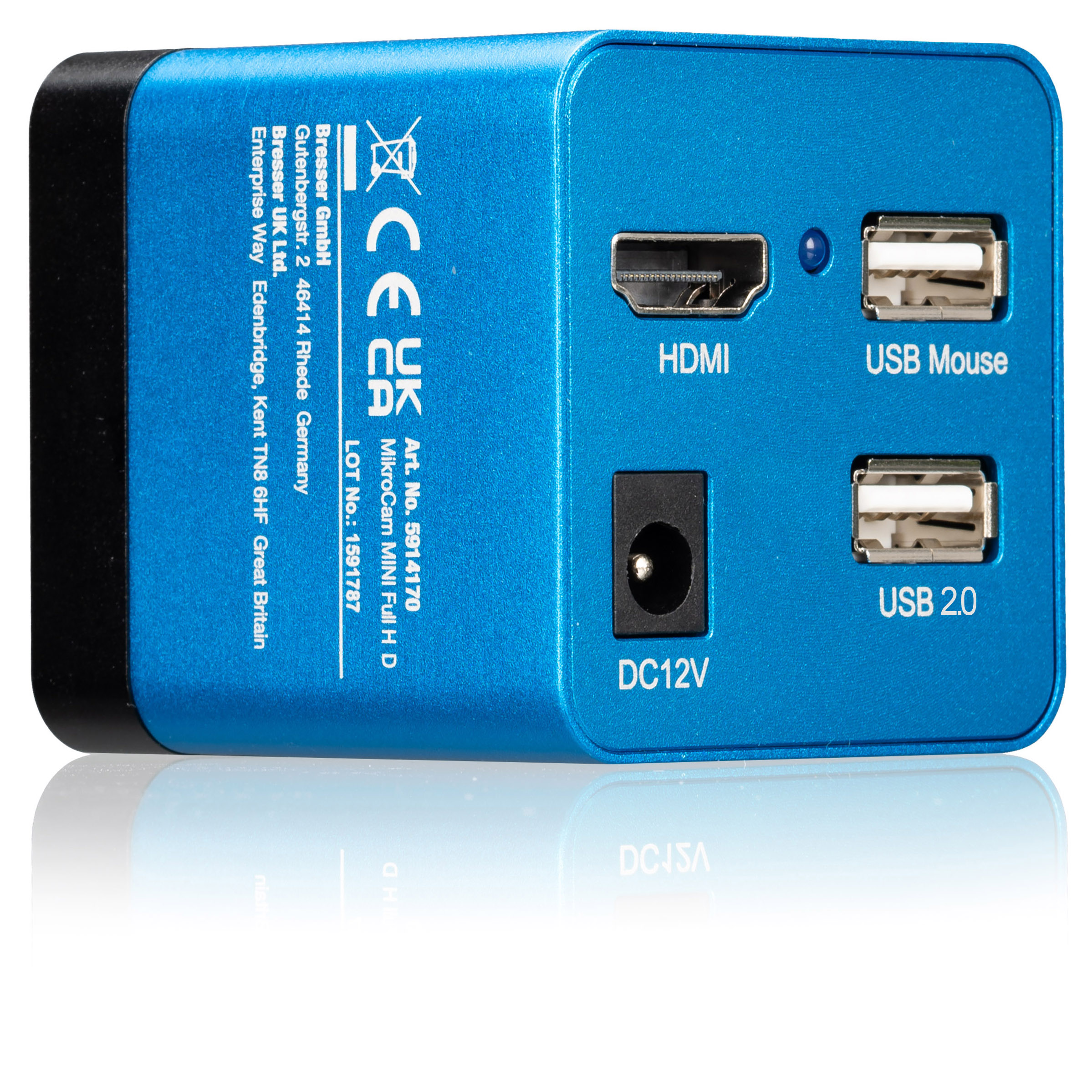 Una caja electrónica azul con puertos HDMI, USB y DC12V sobre una superficie blanca reflectante.