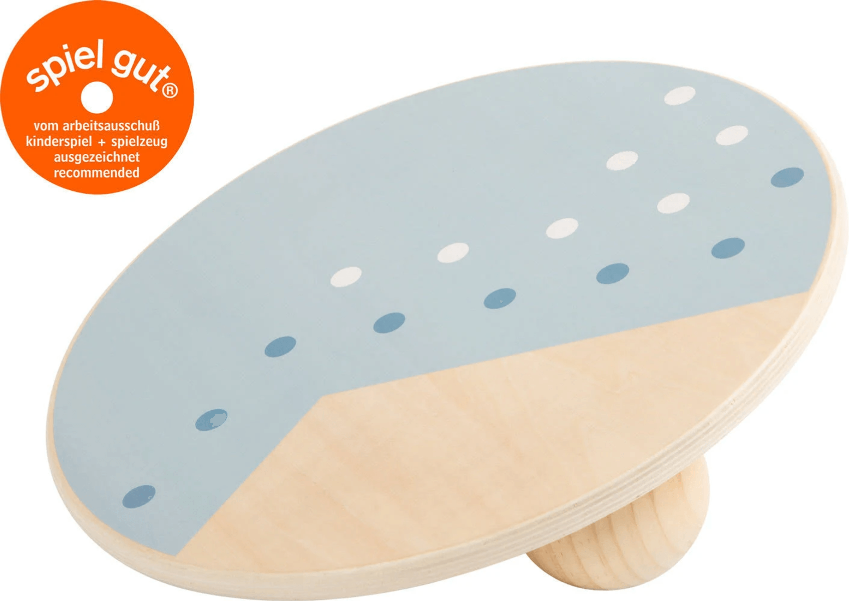Una tabla de equilibrio de madera con un patrón de lunares azules y blancos y un sello redondo spiel gut.
