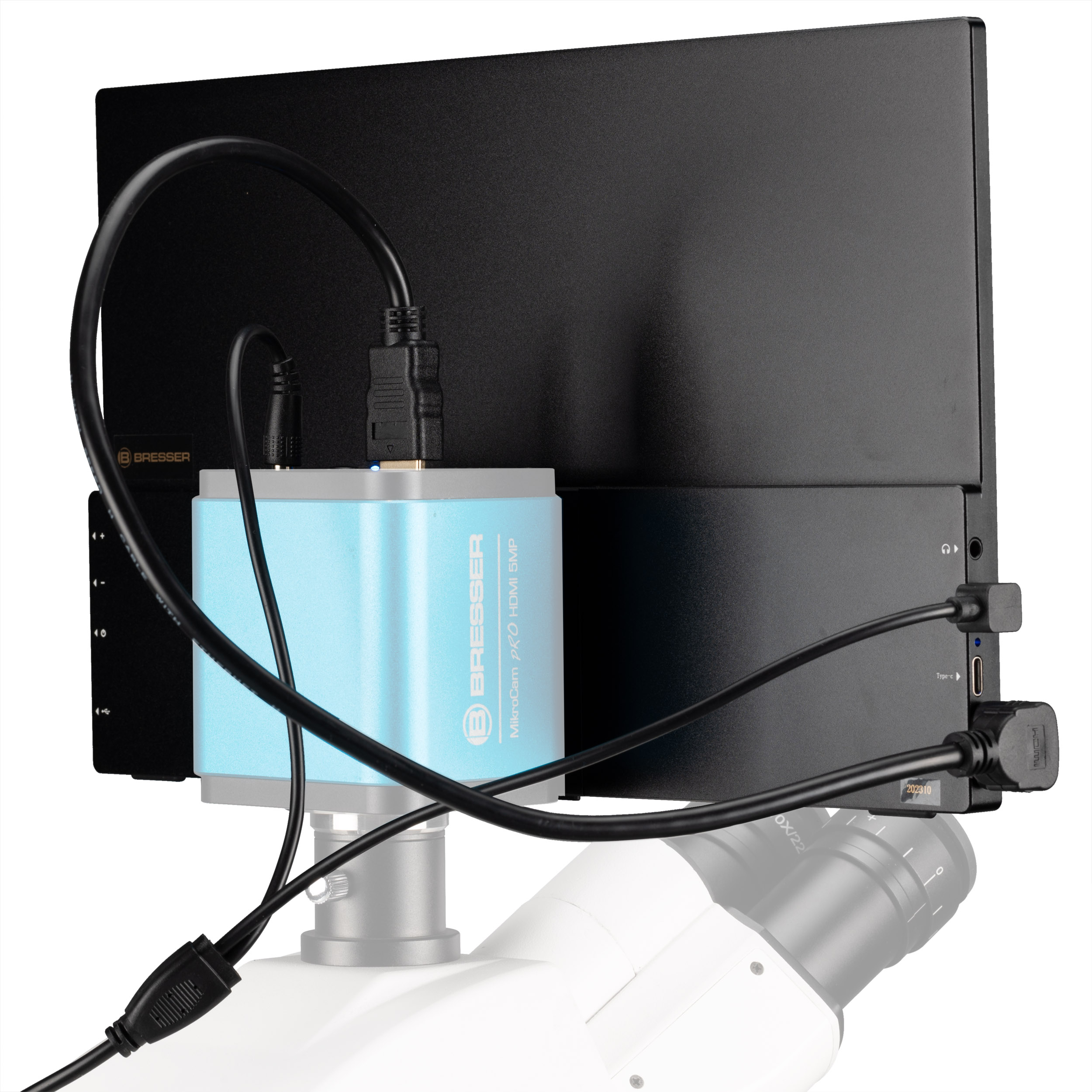 Una cámara de microscopio Bresser azul clara conectada a una pantalla negra con varios cables.