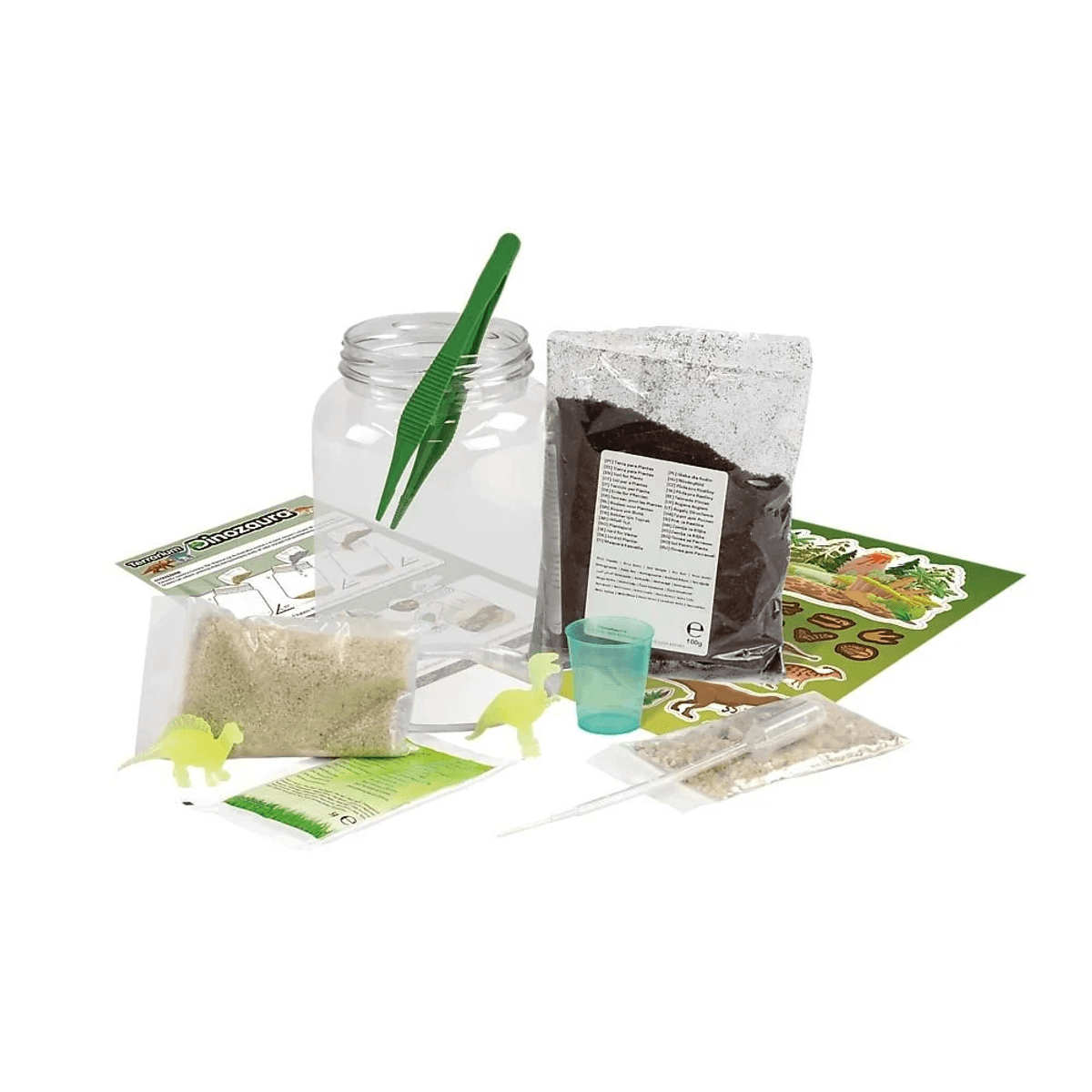 Un kit de terrario de dinosaurios con tarro de cristal, tierra, arena, pinzas verdes, figuras y manual.