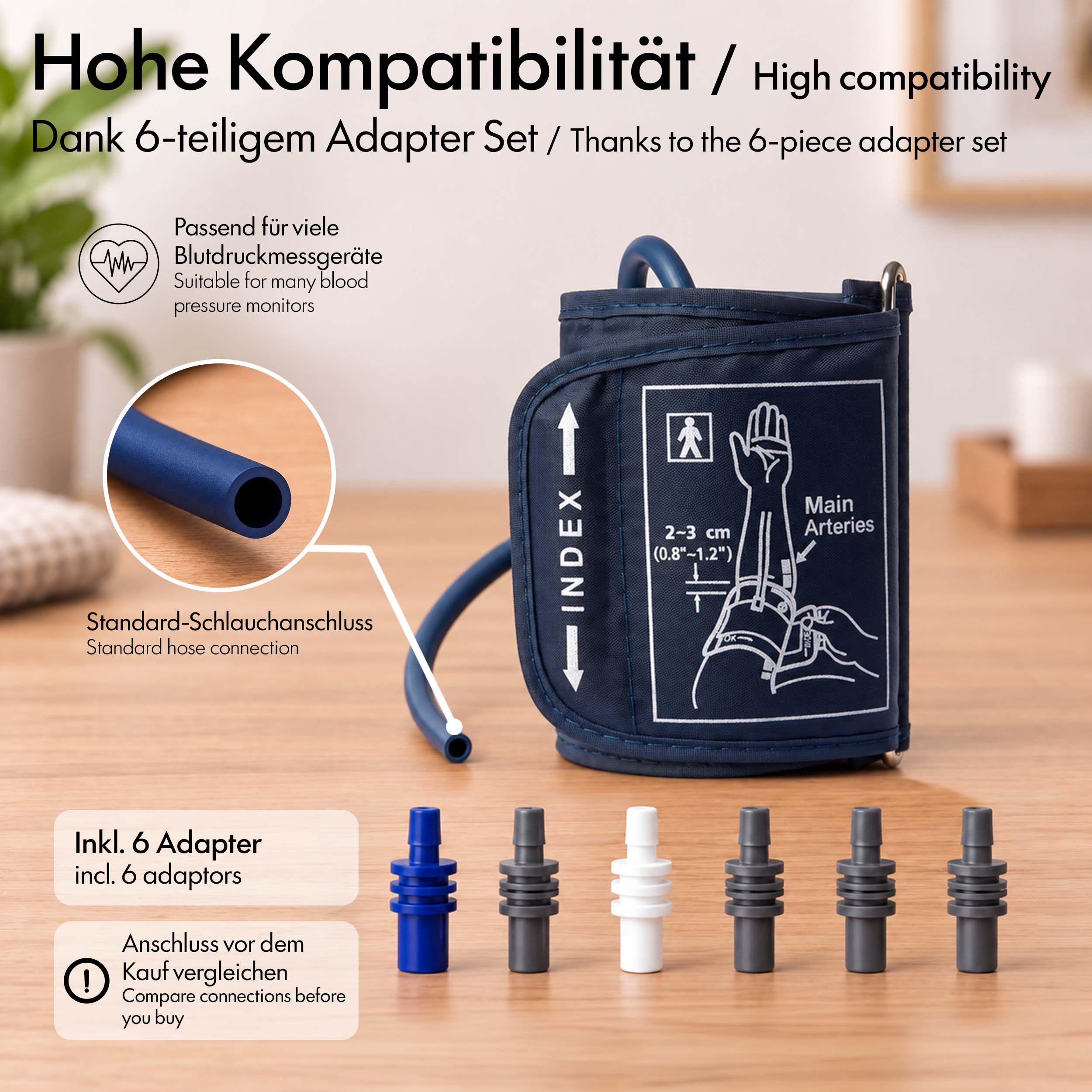 Eine blaue Blutdruckmanschette mit sechs verschiedenen Adaptern auf einem Holztisch.