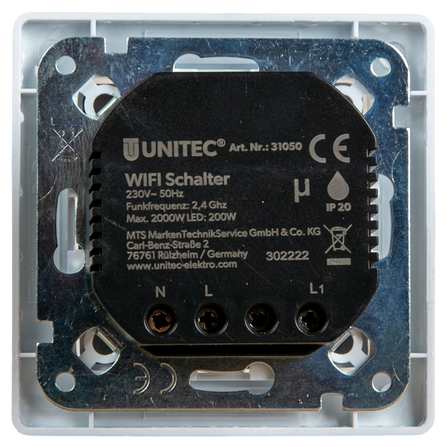 Ein schwarzer Unitec WLAN-Schalter mit Schraubklemmen auf Metallrahmen und weißer Kunststoffbasis.