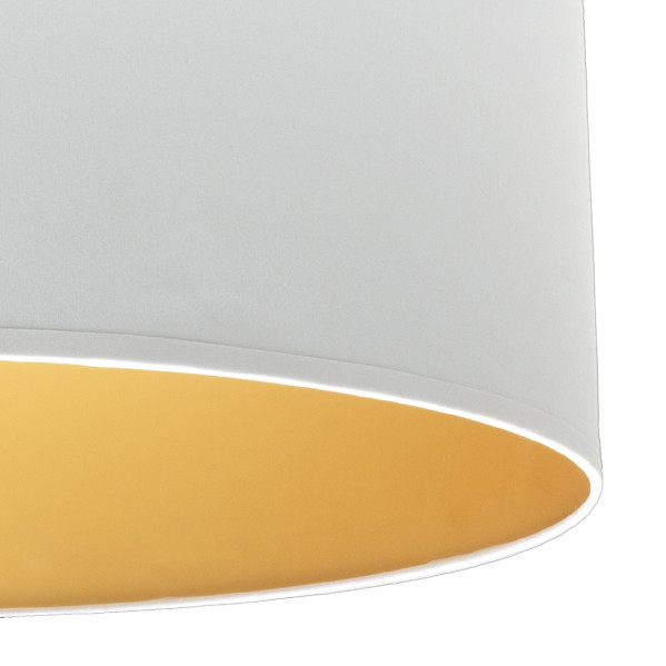 Una pantalla de lámpara cilíndrica blanca con interior dorado.