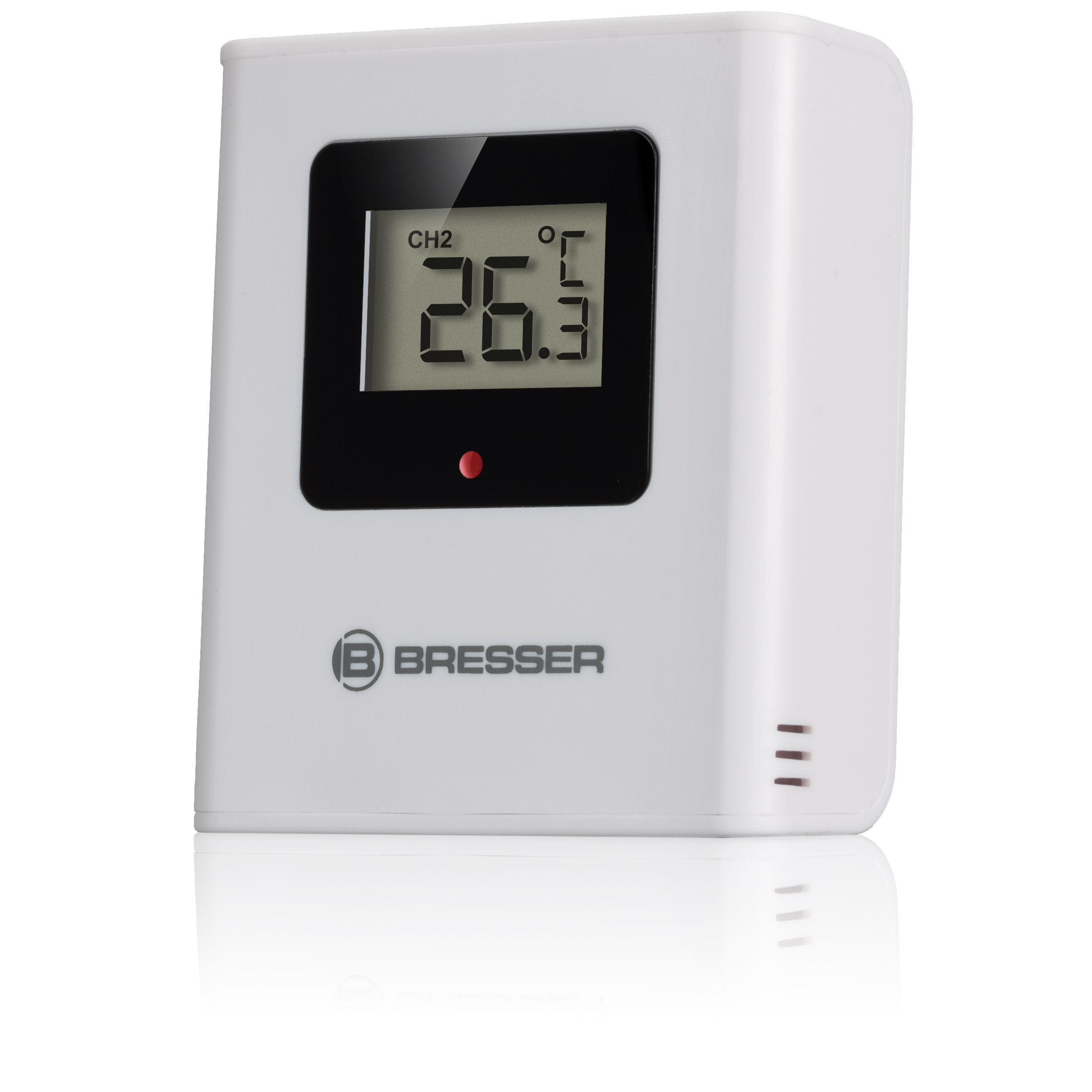 Un termómetro digital Bresser blanco muestra 26.3 grados Celsius con una pequeña luz roja debajo de la pantalla.