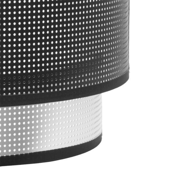 Primer plano de una pantalla de lámpara negra de dos niveles con pequeñas perforaciones.