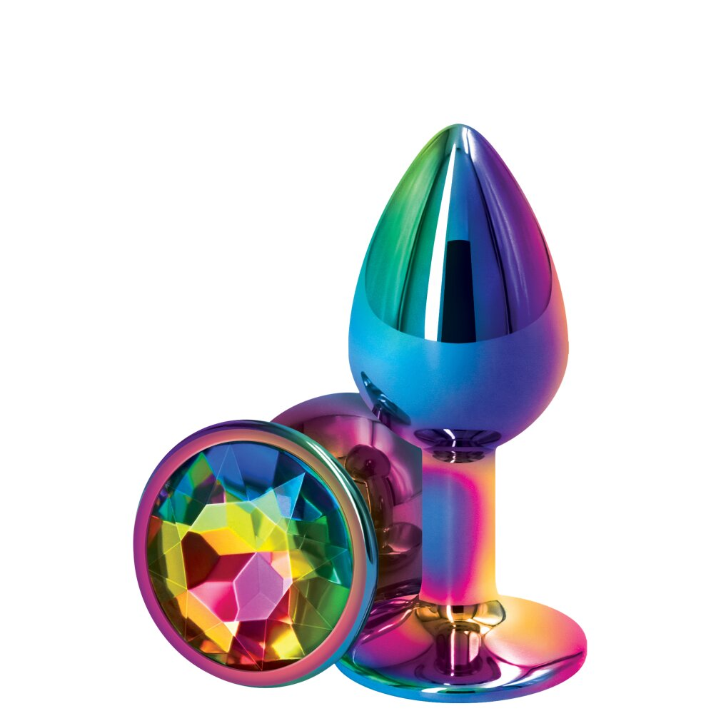 Ein glänzendes, regenbogenfarbenes Analplug mit einem facettenreichen Juwel am Griff gegen weißem Hintergrund.