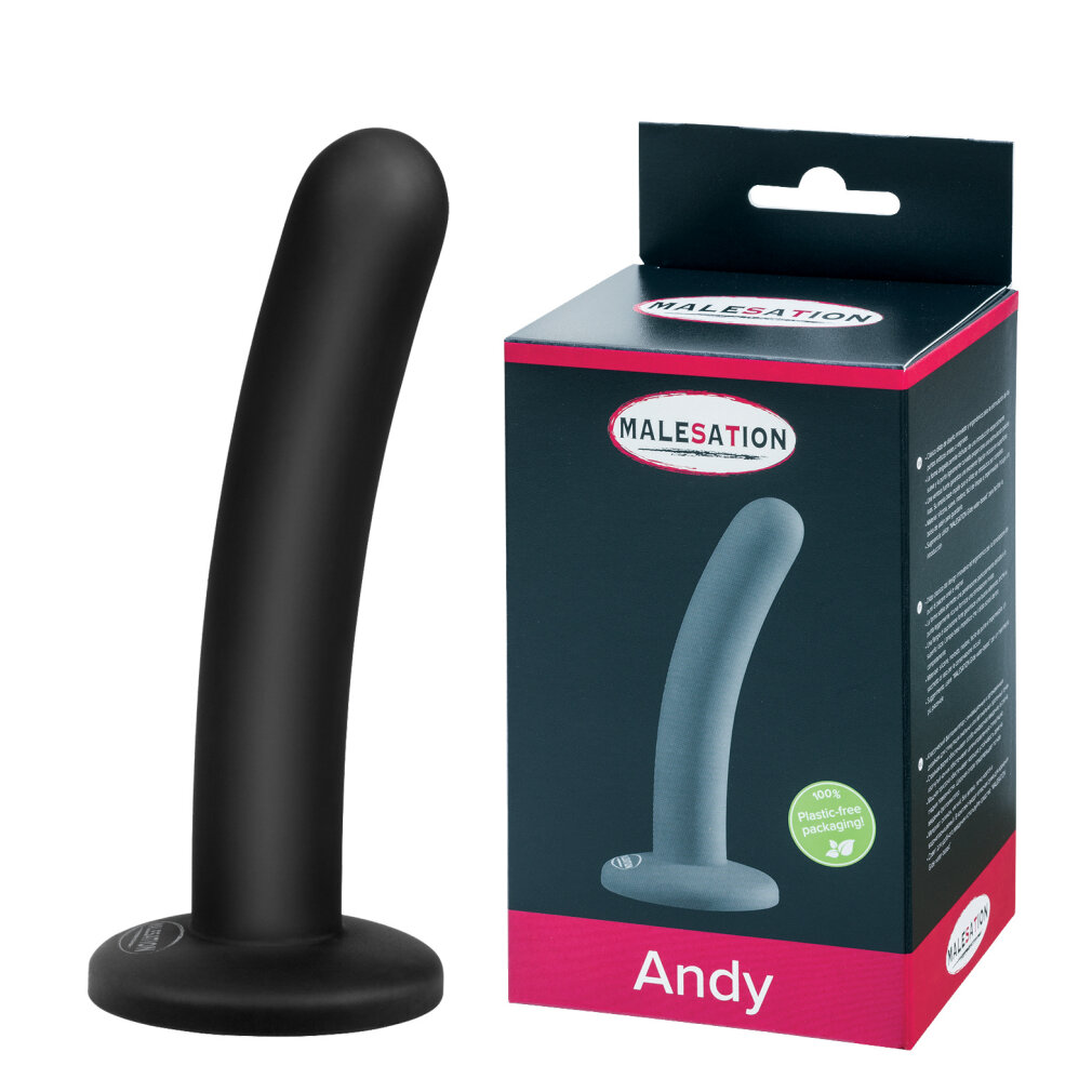 Ein schwarzer, leicht gebogener Dildo mit flacher Basis steht neben seiner pink-schwarzen Verpackung mit der Aufschrift Andy.