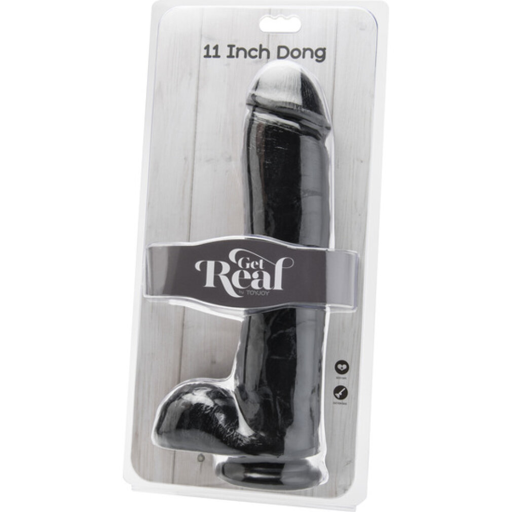 Ein schwarzer, 11 Zoll langer Dildo in transparenter Verpackung vor einem Holzhintergrund.