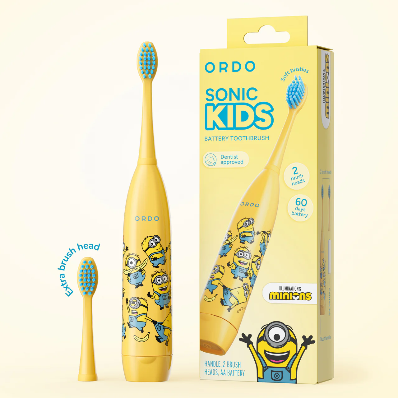 Cepillo de dientes eléctrico infantil Minions amarillo con cerdas azules, cabezal extra y caja en fondo claro.