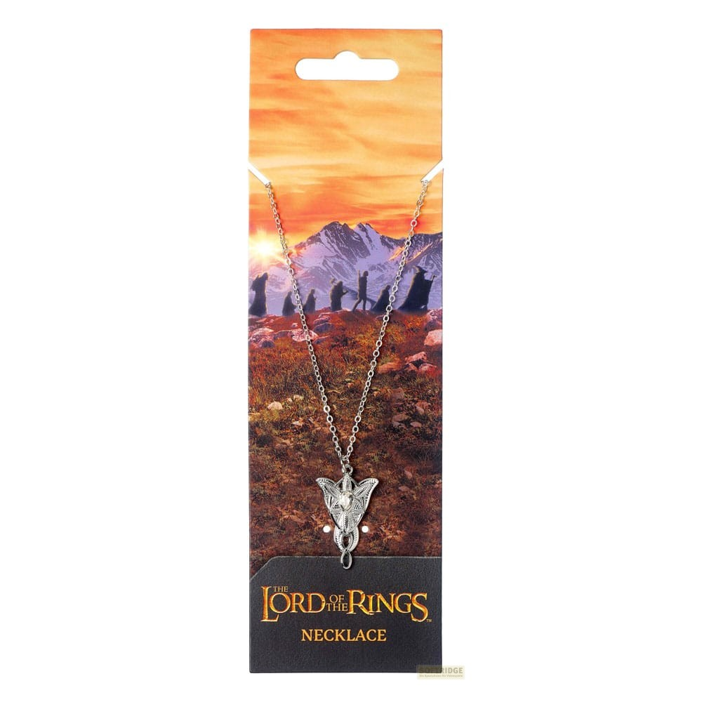 Collar de El Señor de los Anillos con colgante en una tarjeta con montañas.