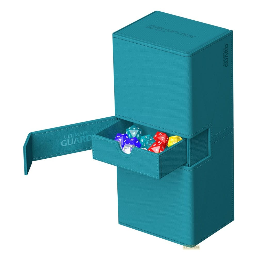 Une boîte de deck turquoise avec un tiroir ouvert contient des dés colorés.