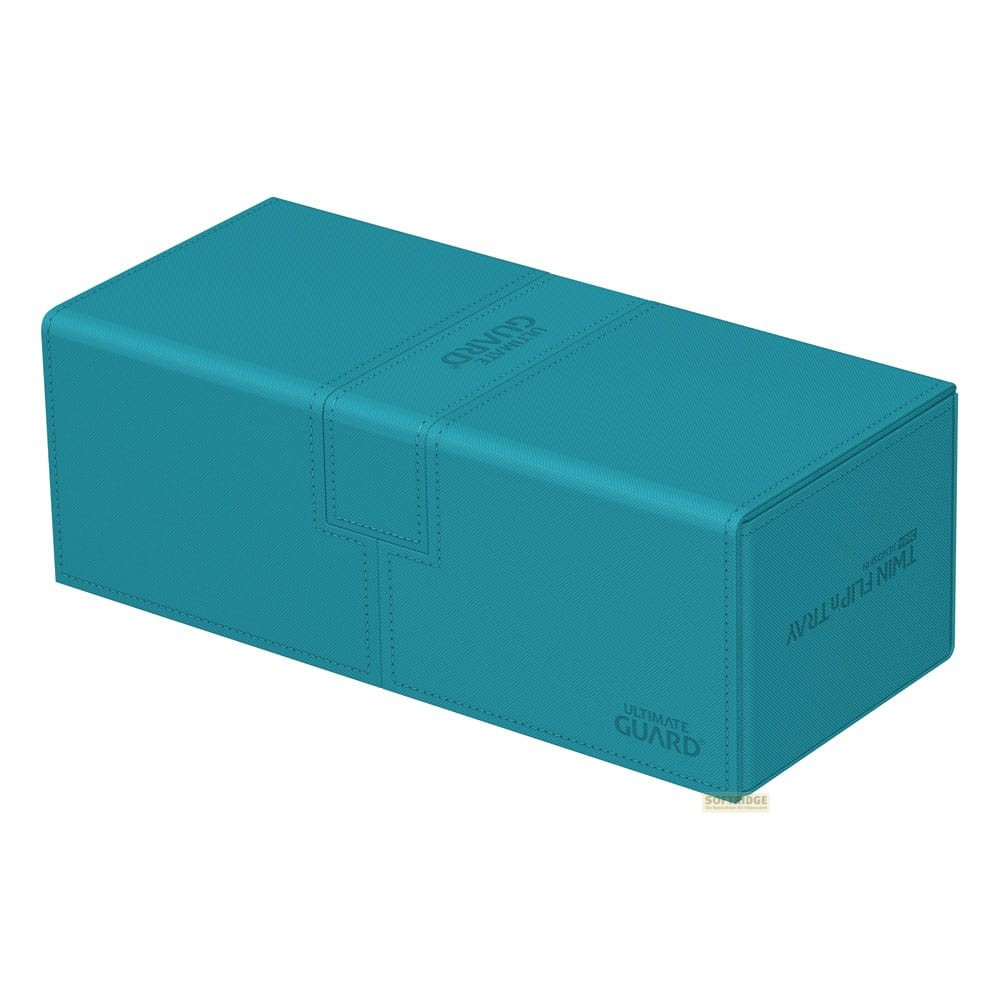 Une boîte de cartes Ultimate Guard Twin Flip'n'Tray turquoise fermée sur fond blanc.