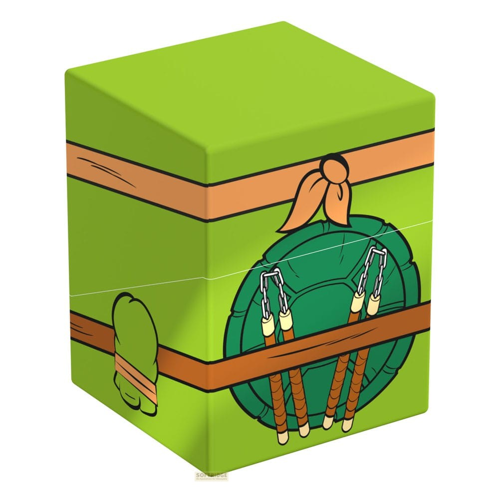 Boîte verte style Tortue Ninja avec carapace et nunchakus sur fond blanc.