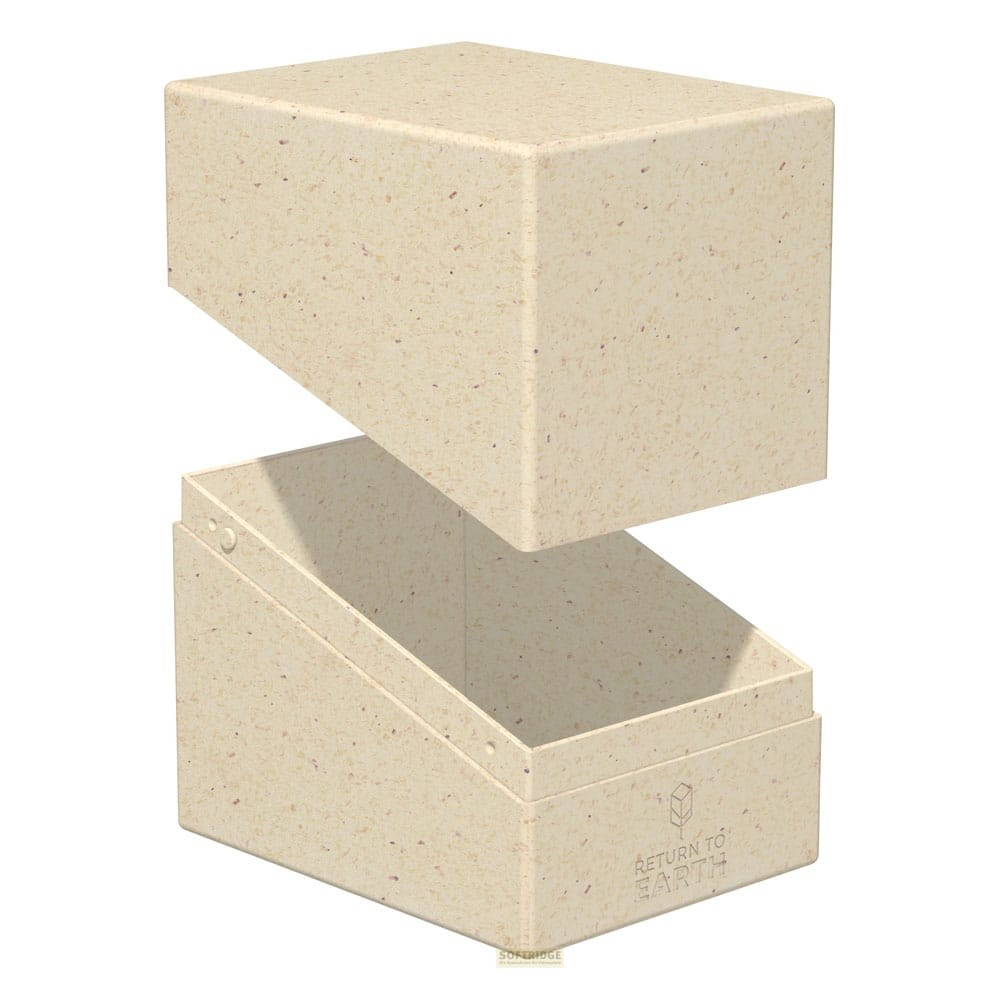 Une boîte en carton beige ouverte avec de petites taches et le texte Return to Earth sur le devant.