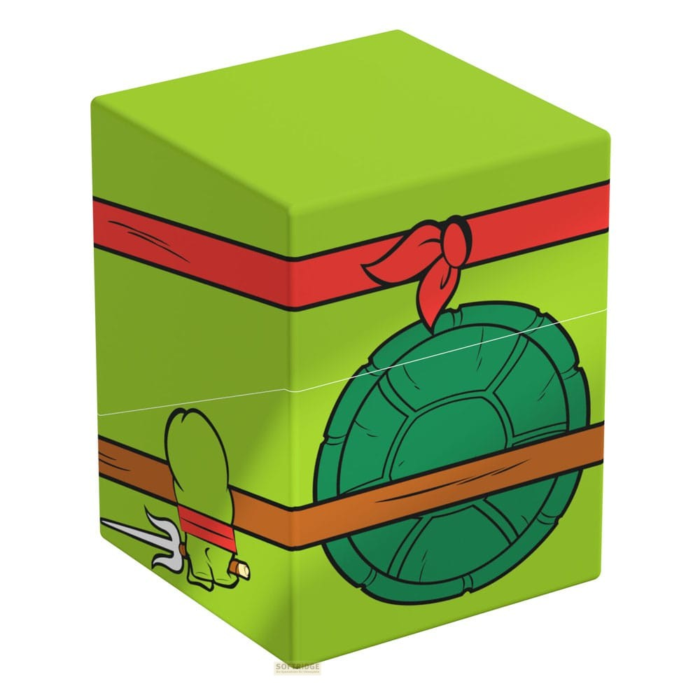 Une boîte de rangement verte style Tortue Ninja, avec un masque rouge, une carapace et une ceinture.