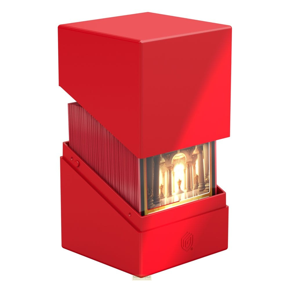Une boîte de cartes rouge contenant un jeu, avec une carte visible montrant des piliers.