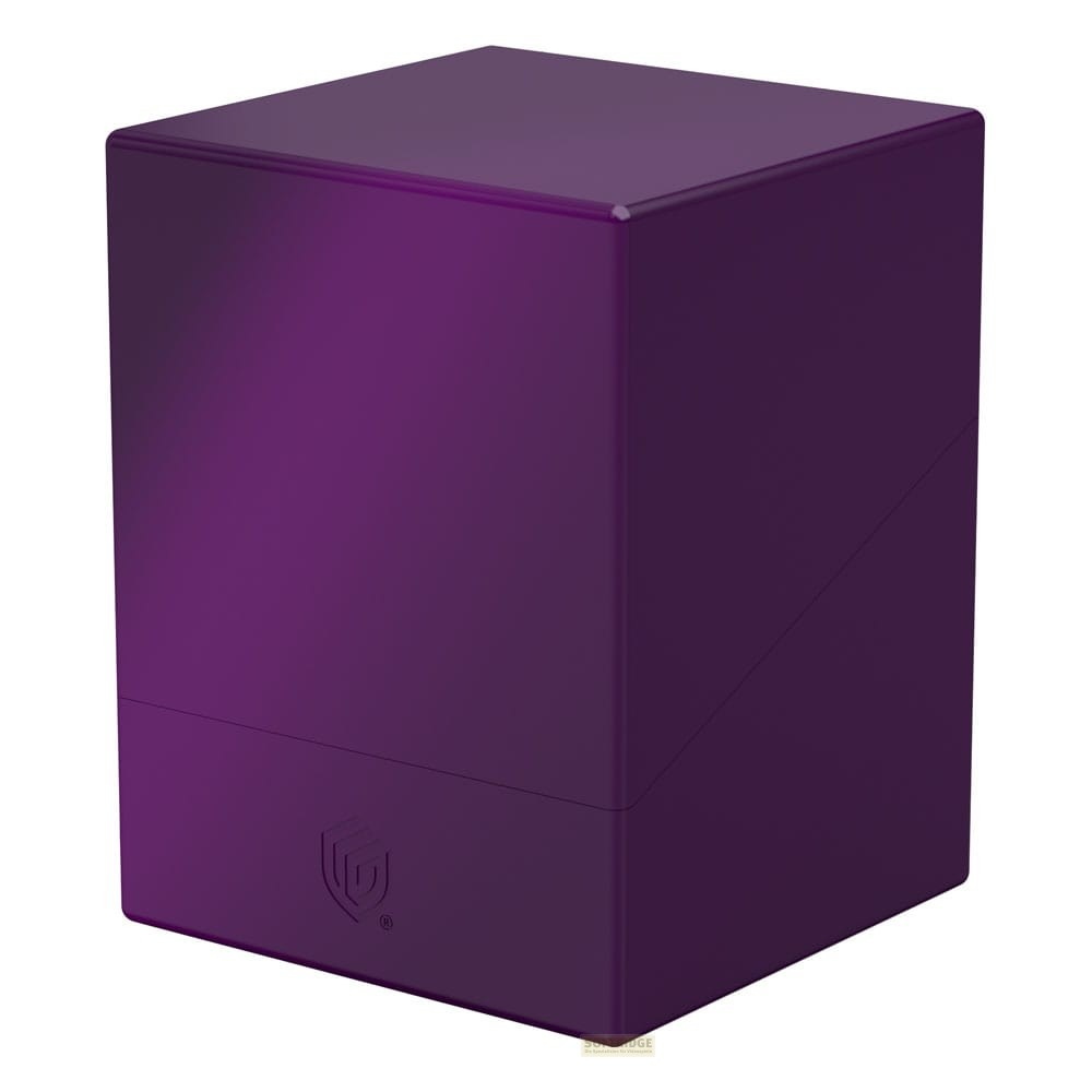 Une boîte de deck violette et brillante avec un logo de bouclier sur fond blanc.