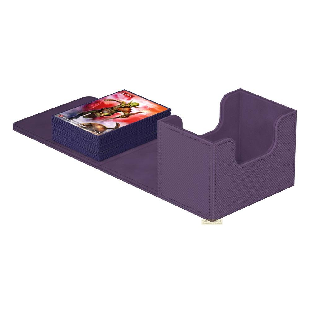 Une boîte de jeu de cartes violette contenant une pile de cartes à gauche.