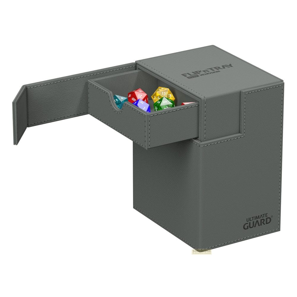 Une boîte à dés en similicuir gris avec un tiroir ouvert contenant des dés colorés.