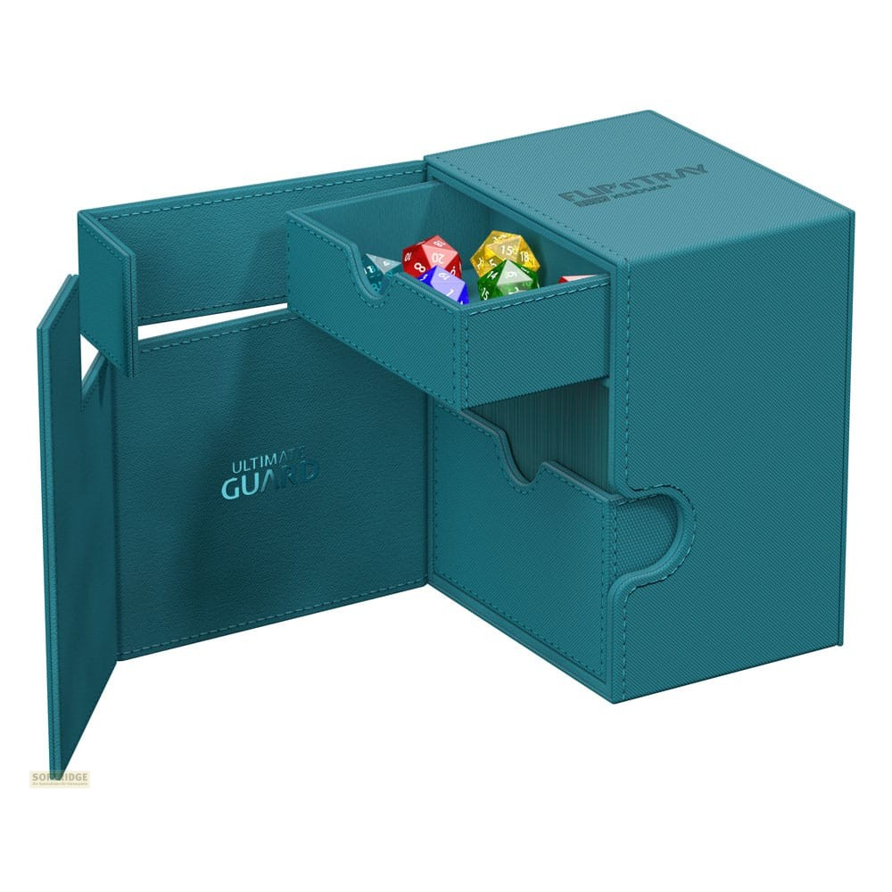 Une boîte Ultimate Guard Flip'n'Tray turquoise avec tiroir ouvert et dés colorés.