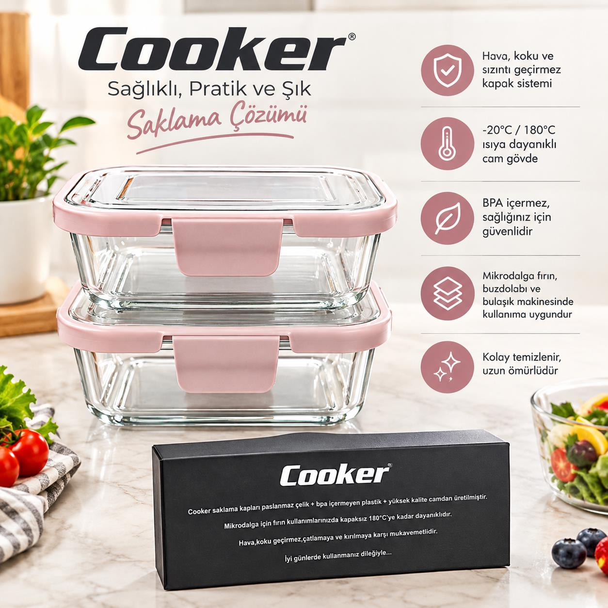 Pembe kapaklı üst üste duran iki cam saklama kabı ve tezgahta siyah Cooker kutusu.