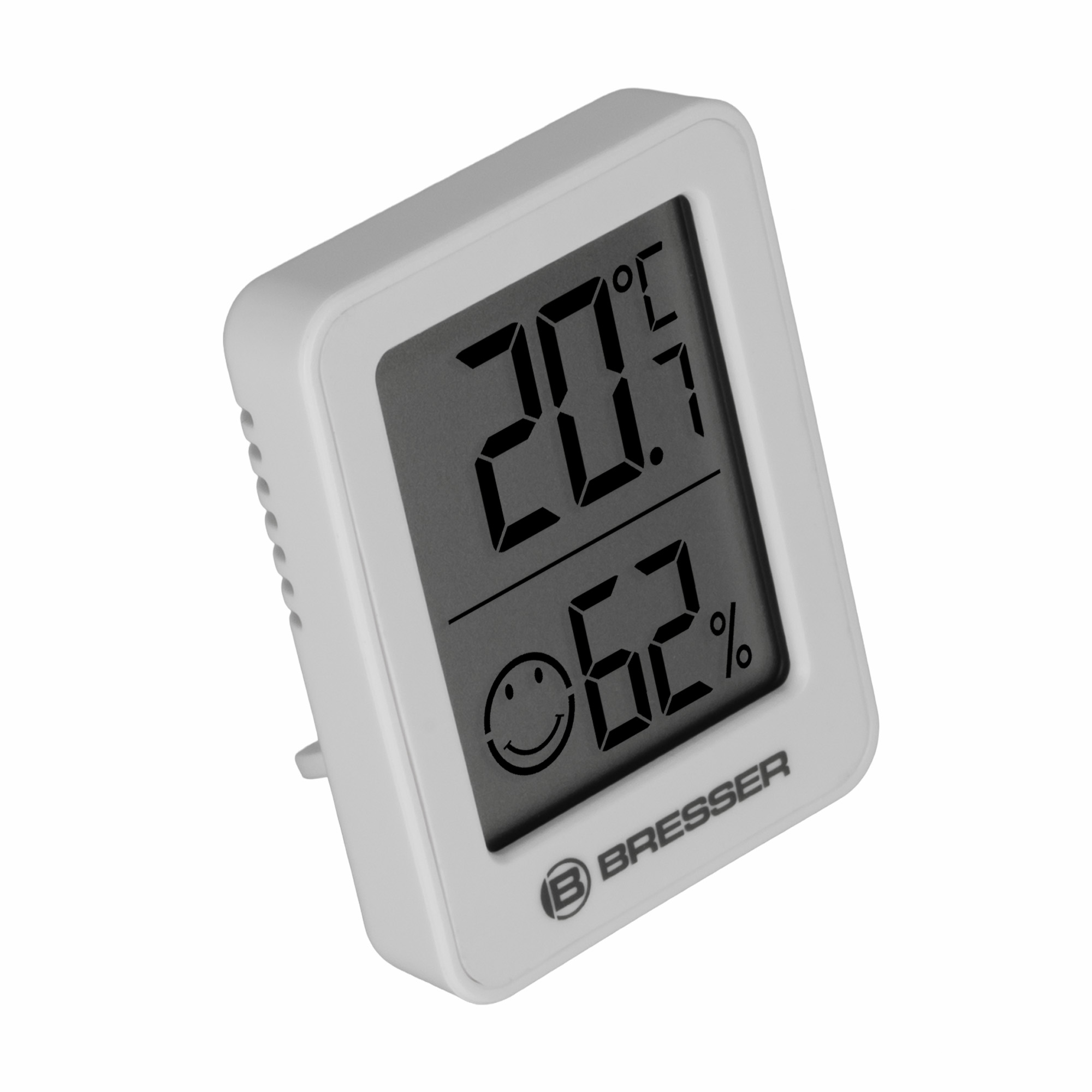 Un termohigrómetro Bresser blanco muestra 20,7°C y 62% de humedad con una cara sonriente.