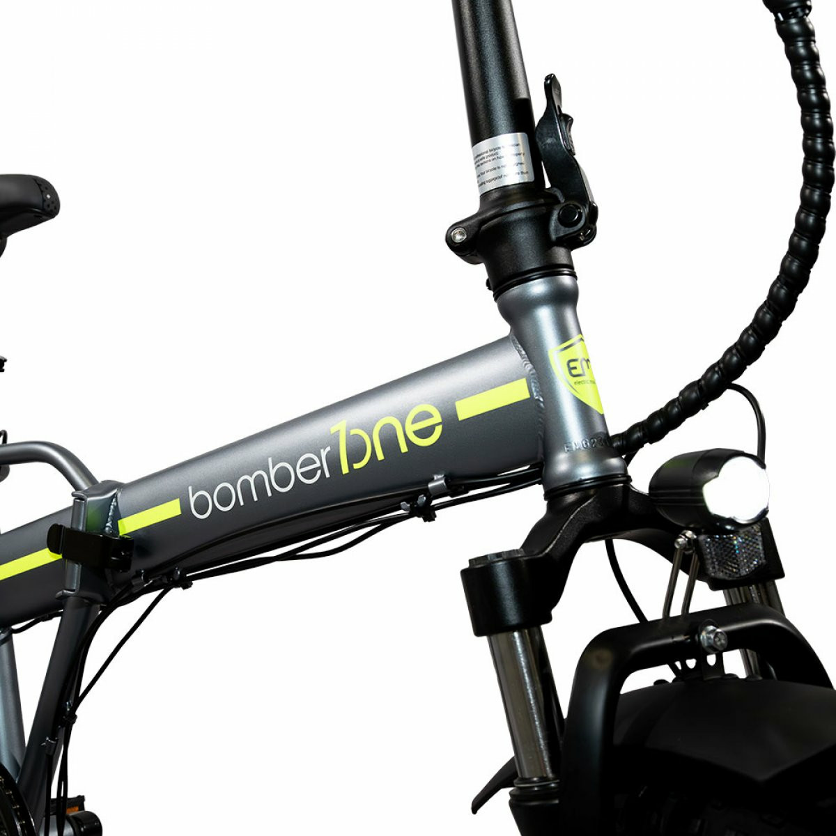 Telaio per e-bike grigio Bomber con manubrio e luce anteriore su sfondo bianco.