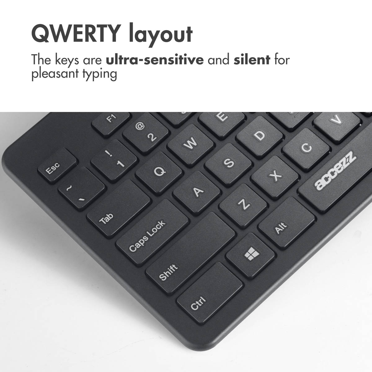 Zbliżenie czarnej klawiatury QWERTY z tekstem podkreślającym czułe i ciche klawisze.