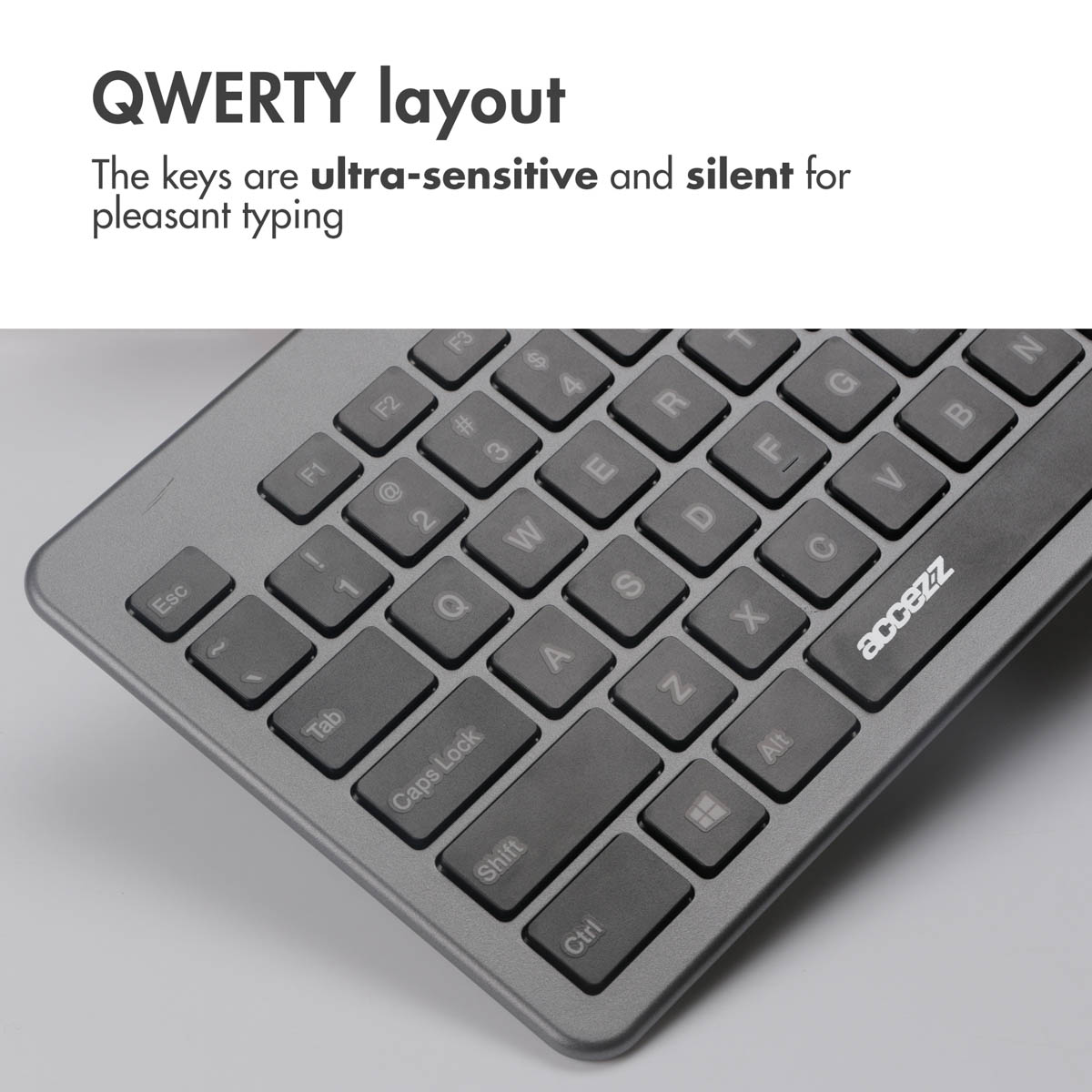 Szara klawiatura QWERTY z zaokrąglonymi klawiszami i logo Accezz.