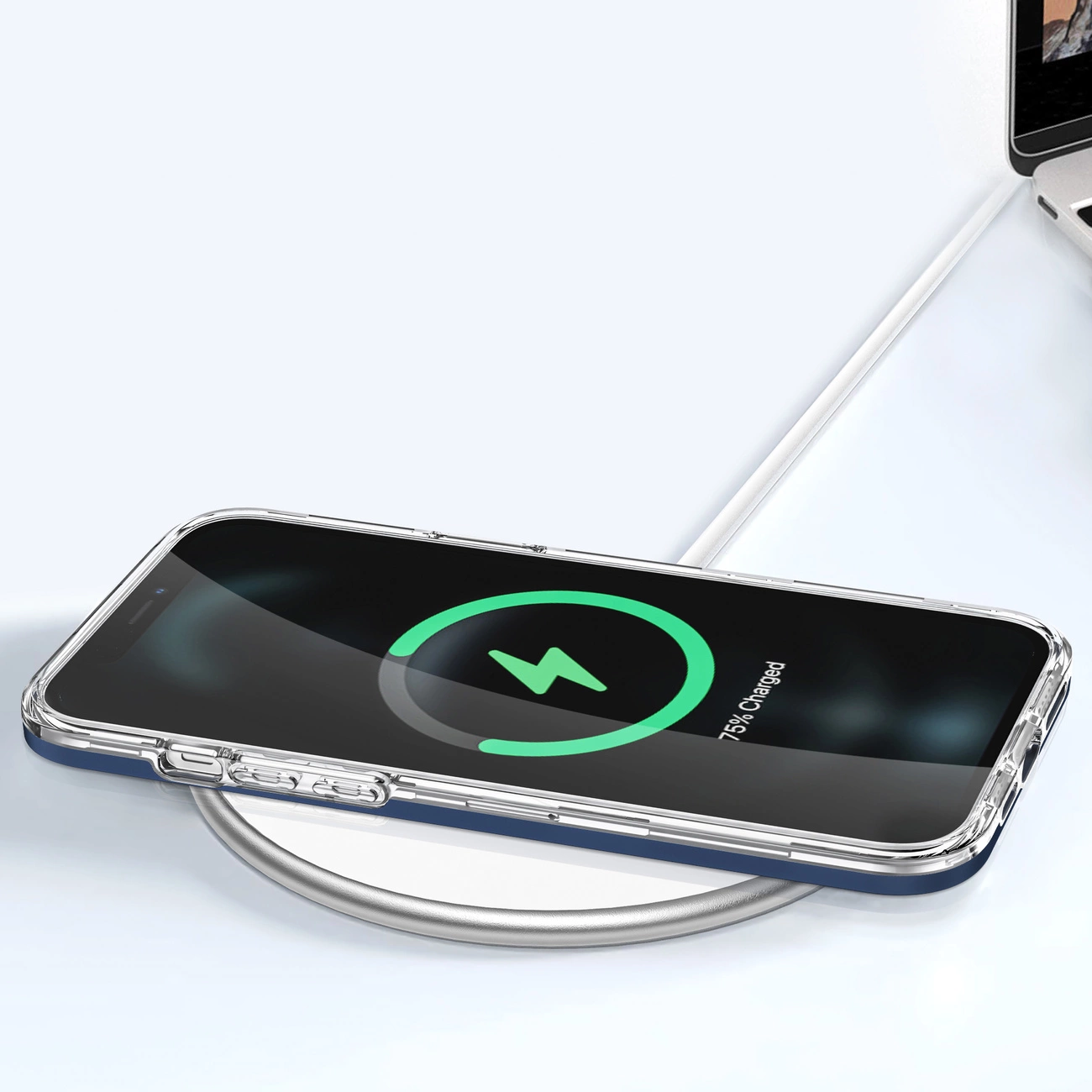 Uno smartphone si ricarica in modalità wireless su una base bianca, mostrando un'icona verde e il 75%.