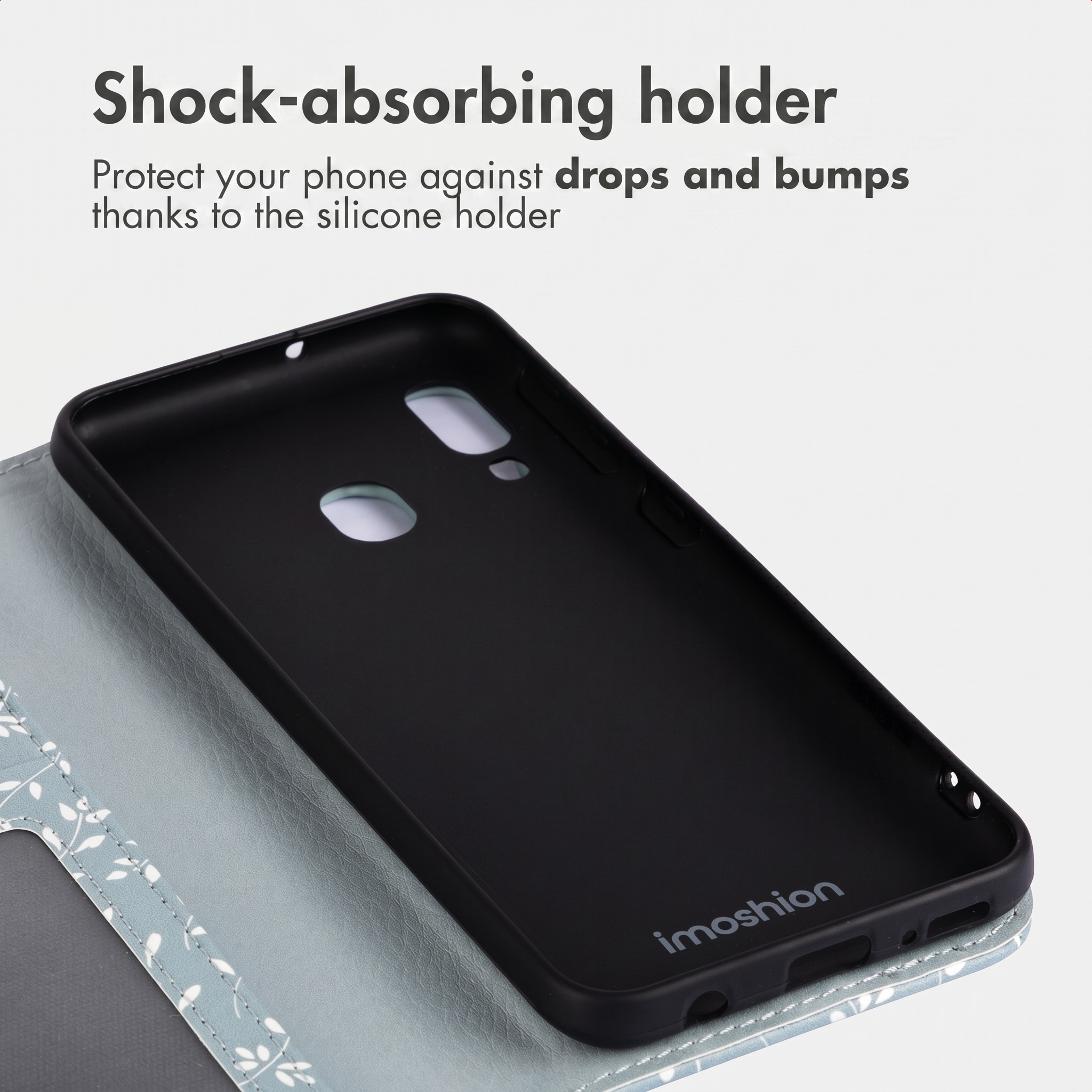 Un supporto per telefono in silicone nero all'interno di una custodia grigia fantasia.