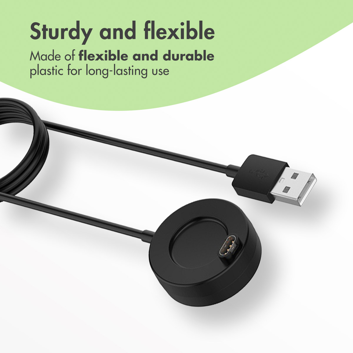 A black smartwatch charging cable with a USB connector against a green background.