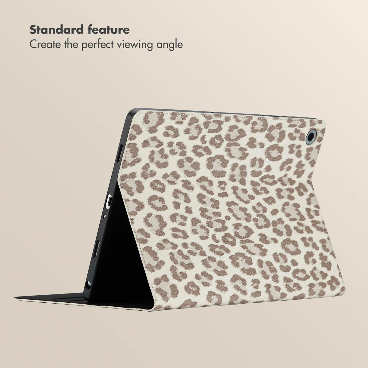 A tablet in a leopard-print case stands on a table, demonstrating its viewing angle feature.