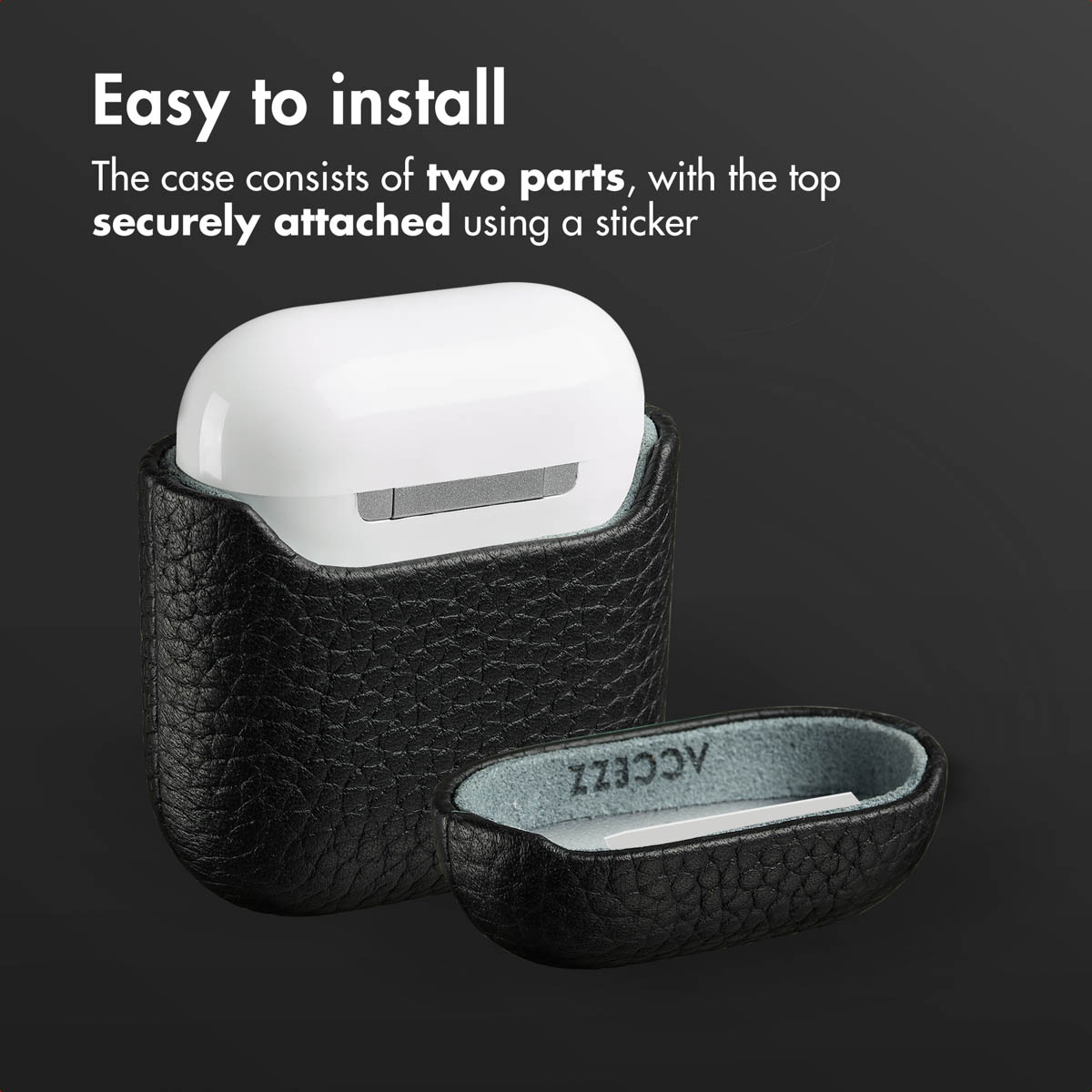 Una funda de piel negra de dos piezas para AirPods con la tapa superior separada sobre fondo oscuro.