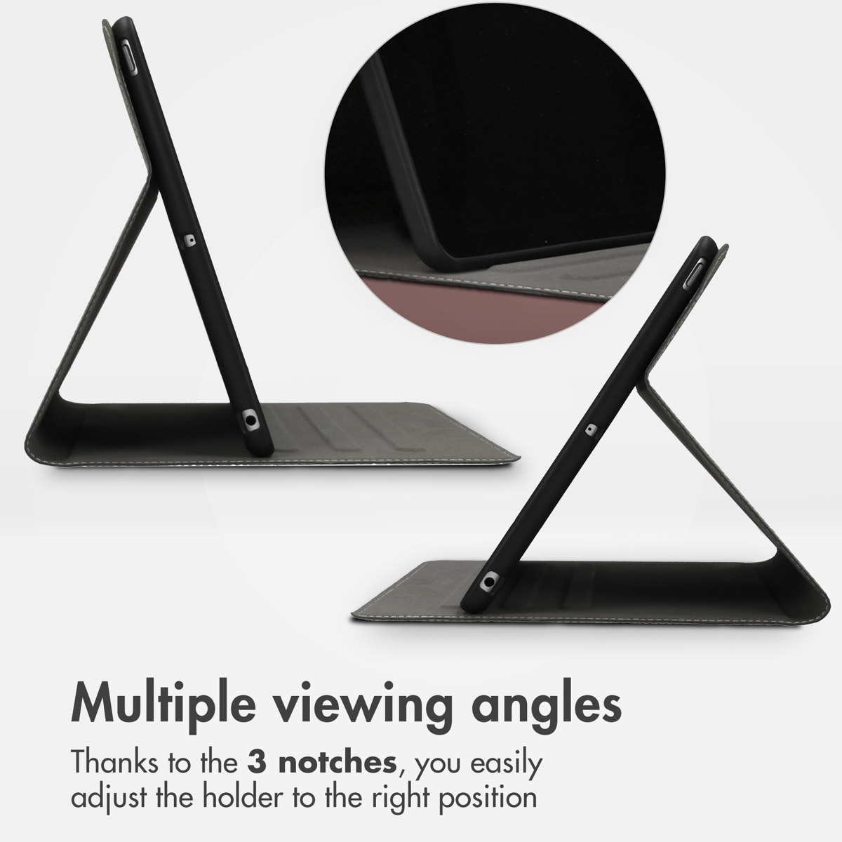 Une tablette noire dans un étui support à angles réglables, avec un détail en médaillon.