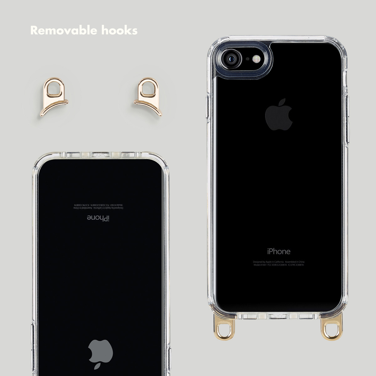 Custodia trasparente per iPhone con due ganci dorati rimovibili sul fondo su sfondo grigio.