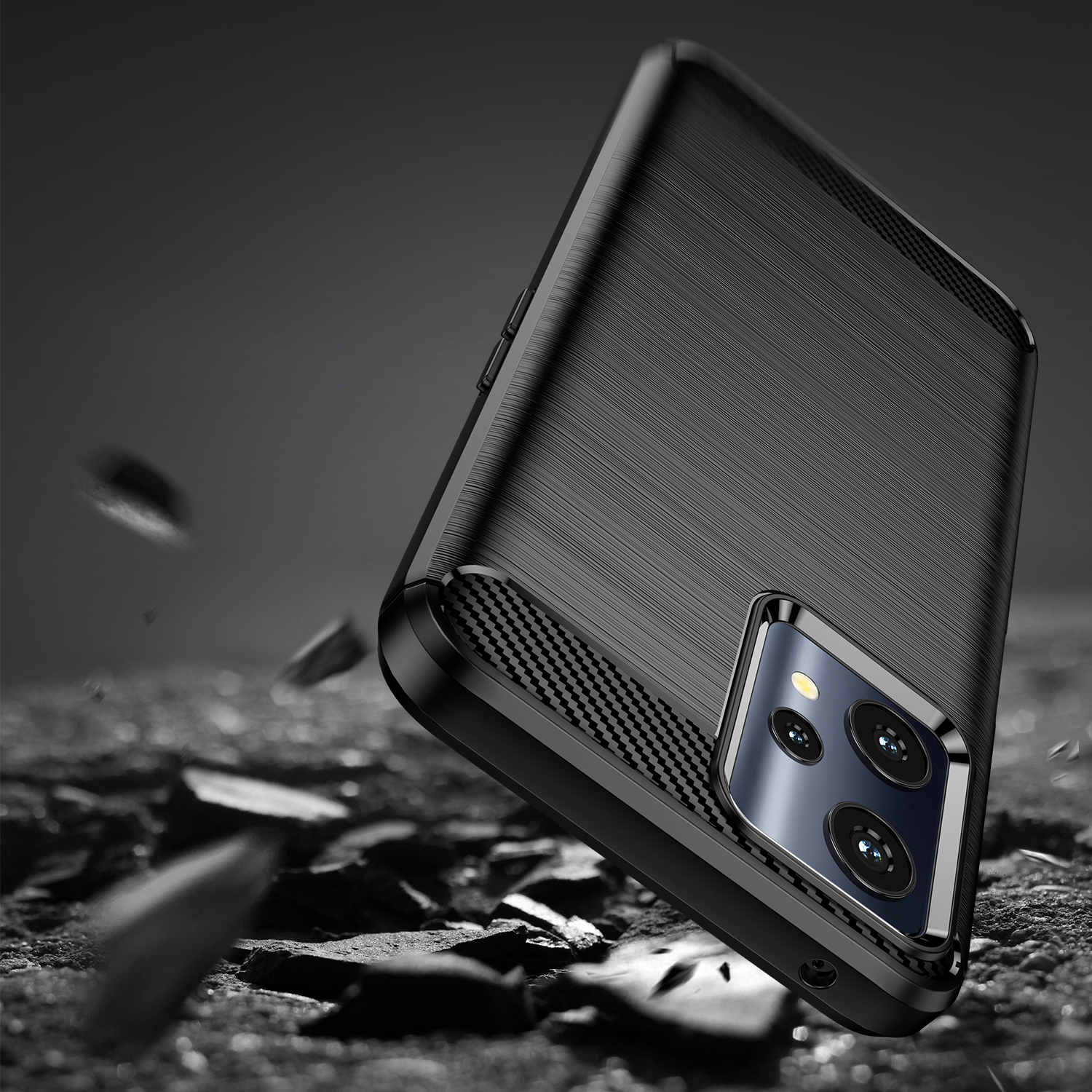 Uno smartphone nero in una custodia protettiva fluttua su rocce frantumate su sfondo scuro.