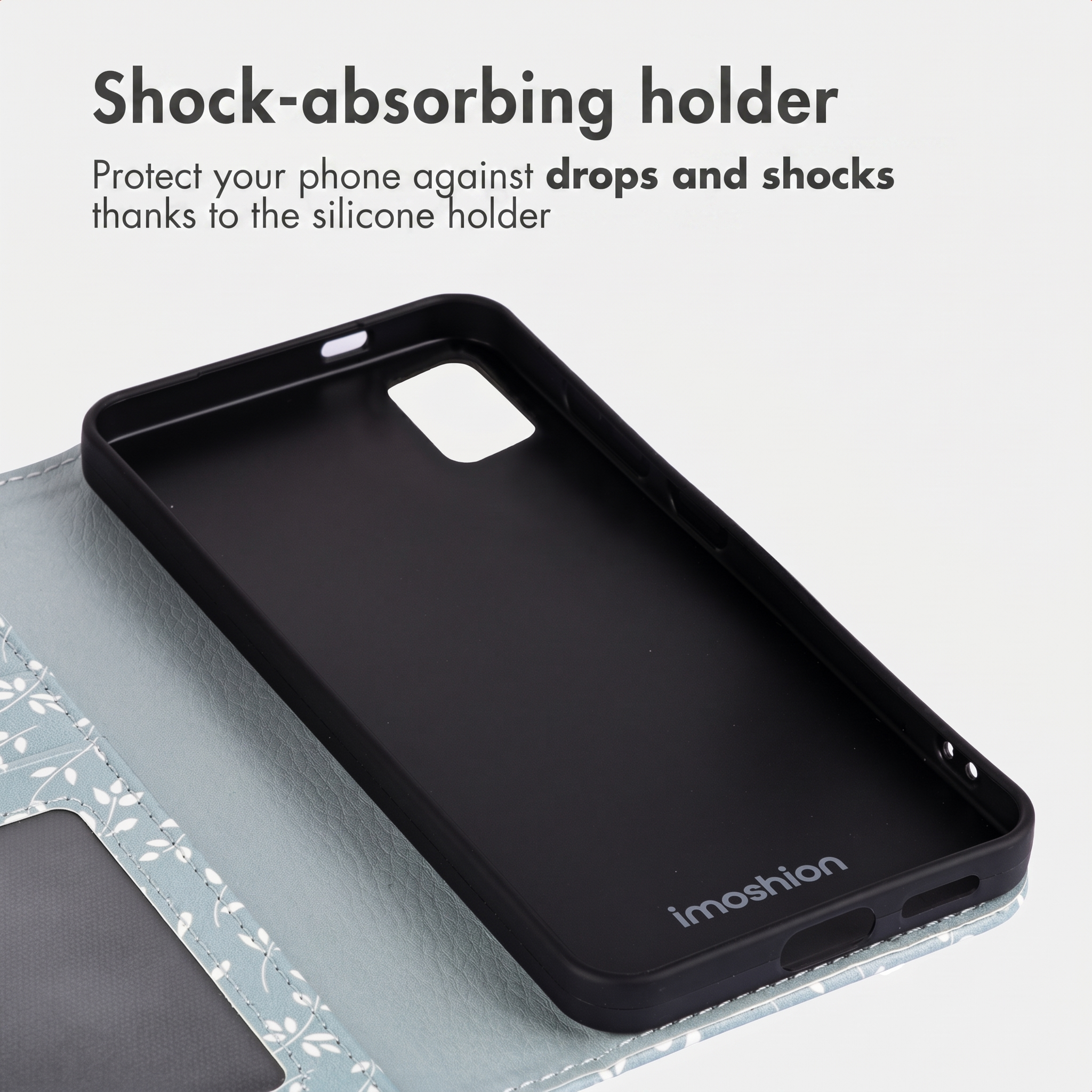 Porta cellulare in silicone nero in una custodia grigia con testo.
