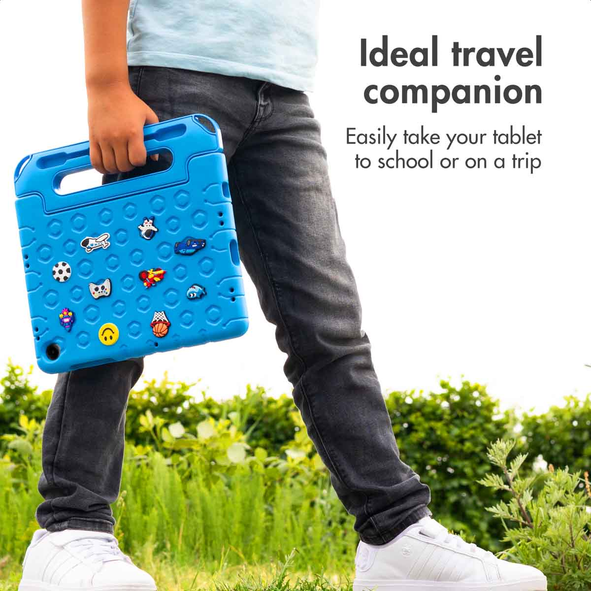 Child holds a blue tablet case outdoors, text reads 'Ideal travel companion'.