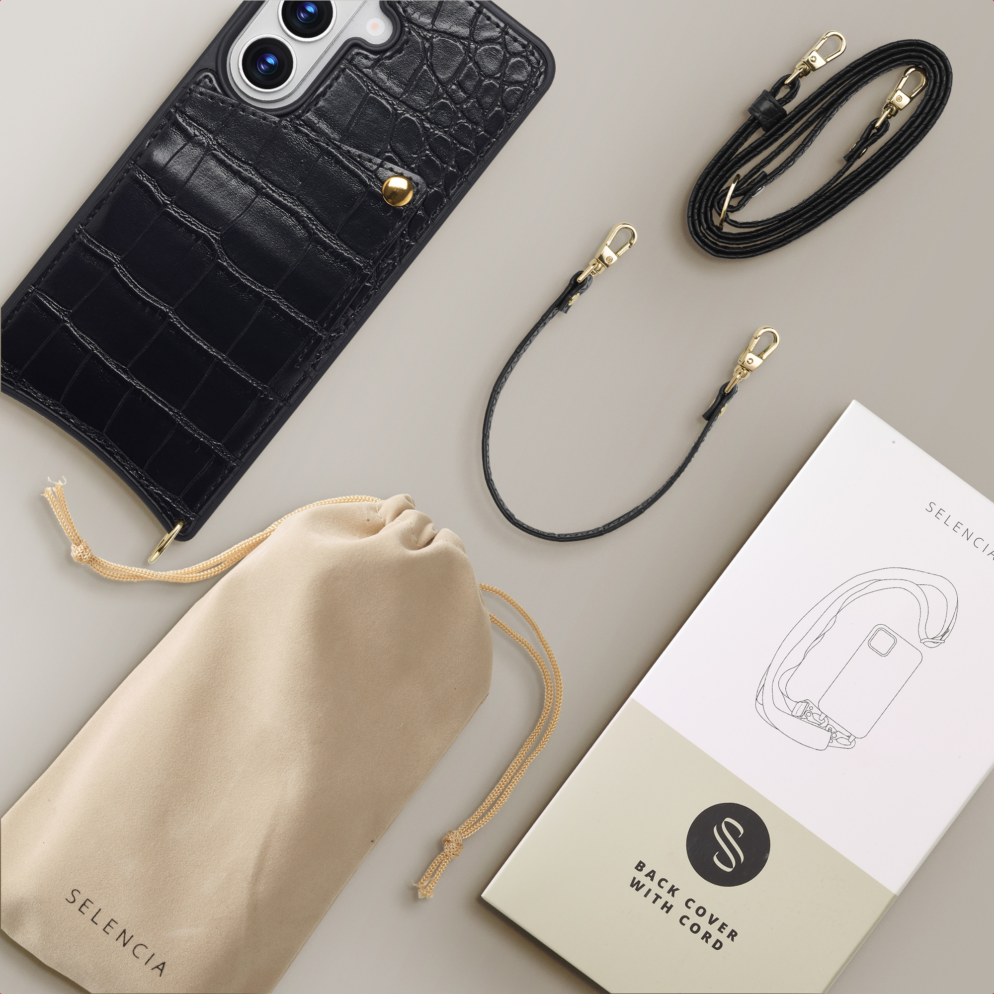 Funda de móvil de cocodrilo negro con correas, bolsa y caja.