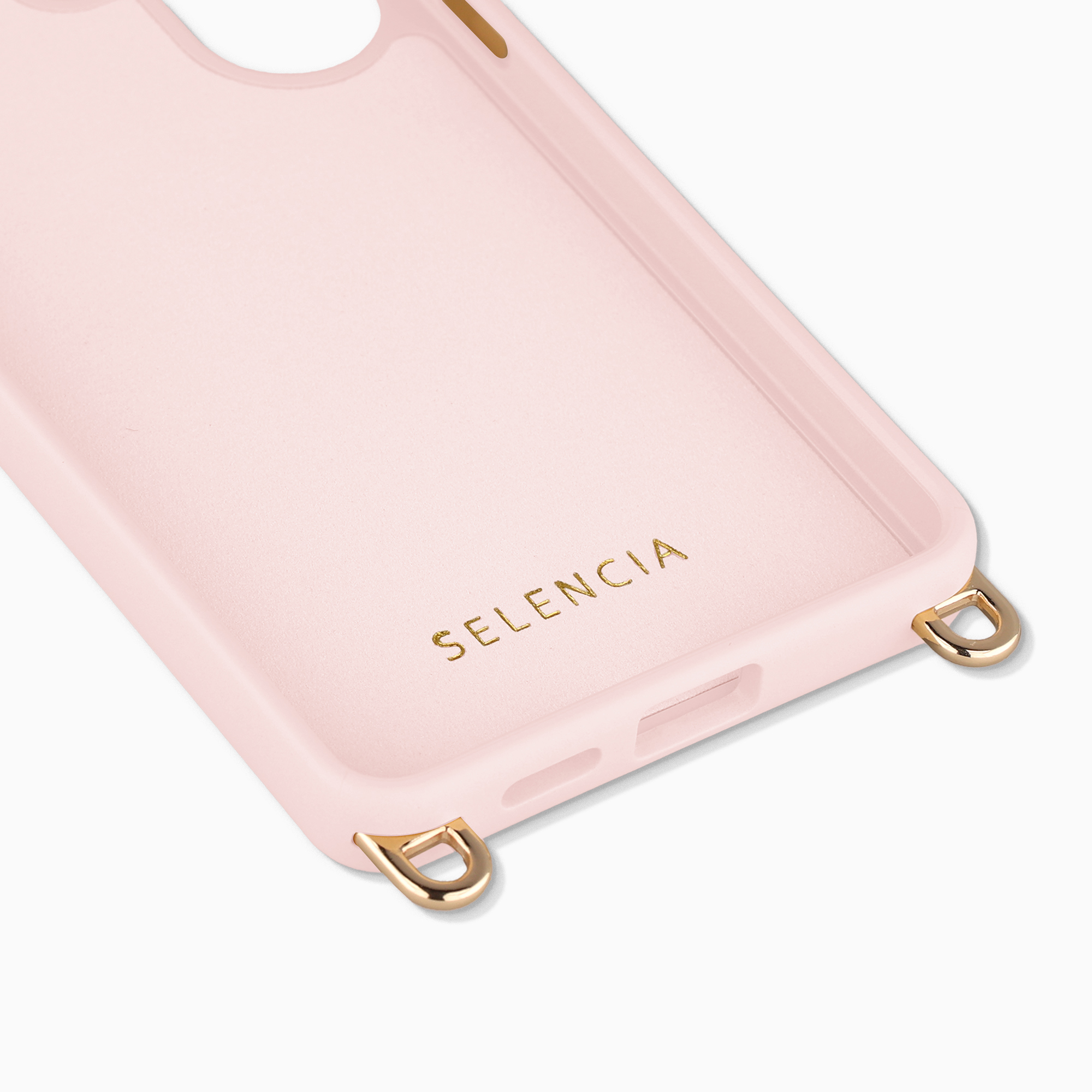Une coque de téléphone rose avec des anneaux dorés et le texte SELENCIA, sur fond blanc.