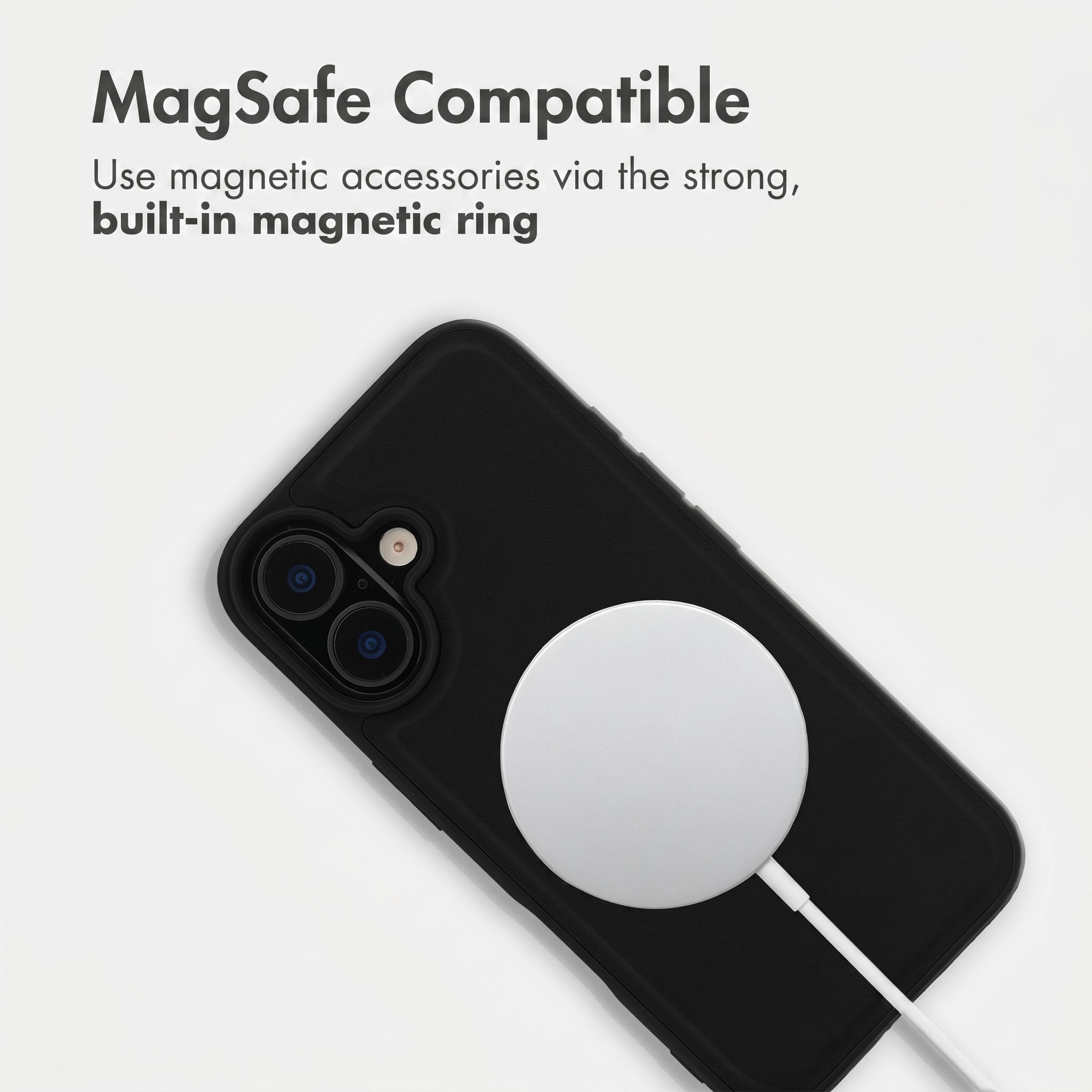 MagSafe compatible black smartphone with a white charging puck attached to the back.