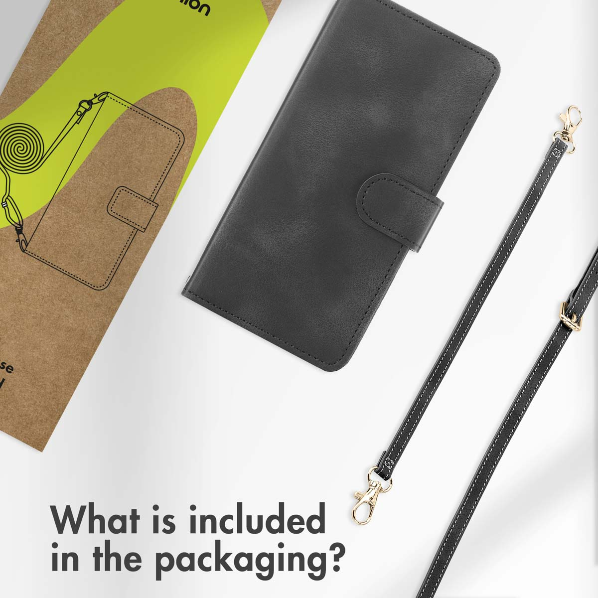 Eine schwarze Handytasche aus Leder und ein passender Riemen neben der Verpackung.