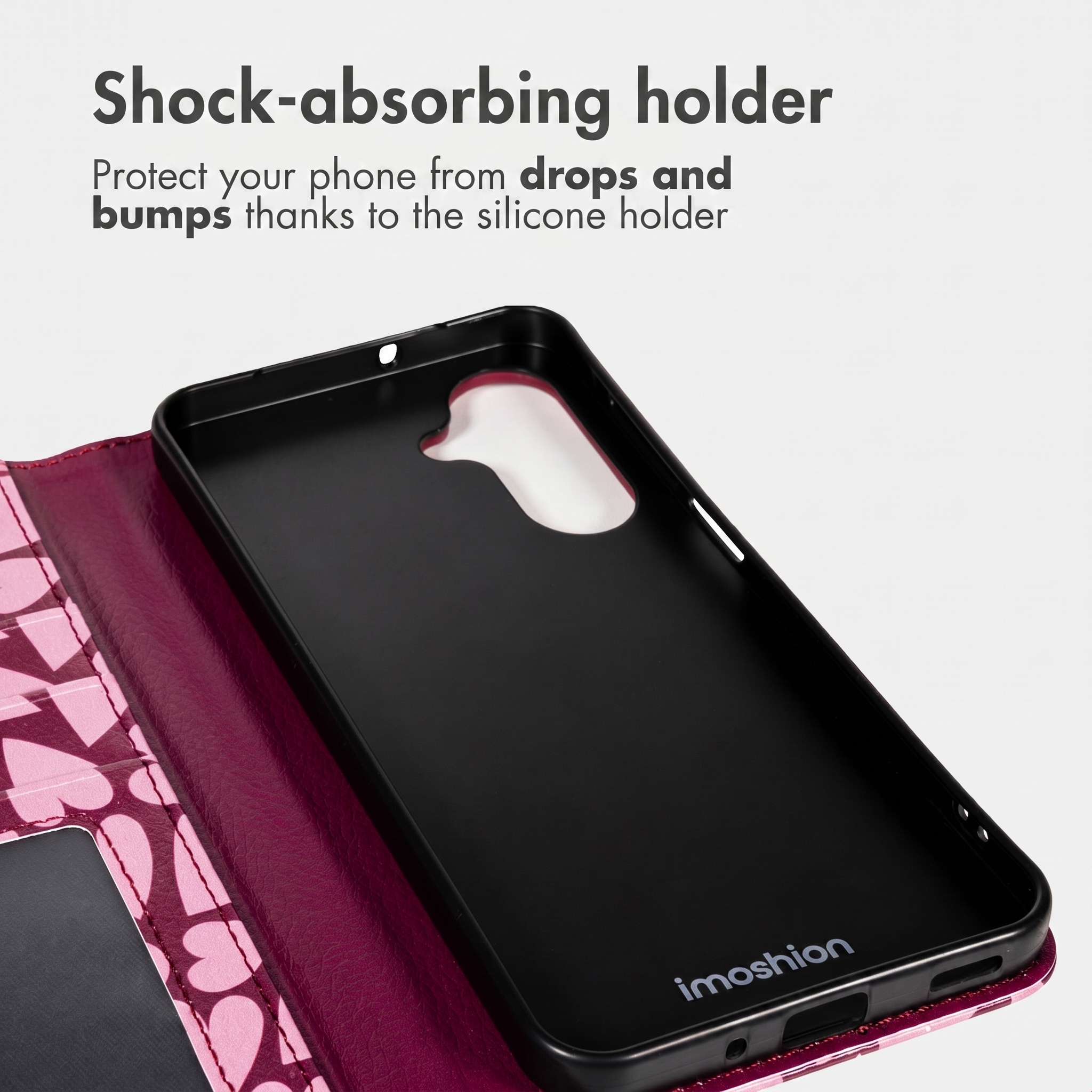 Custodia per telefono rosa con motivo a cuori e supporto in silicone nero.