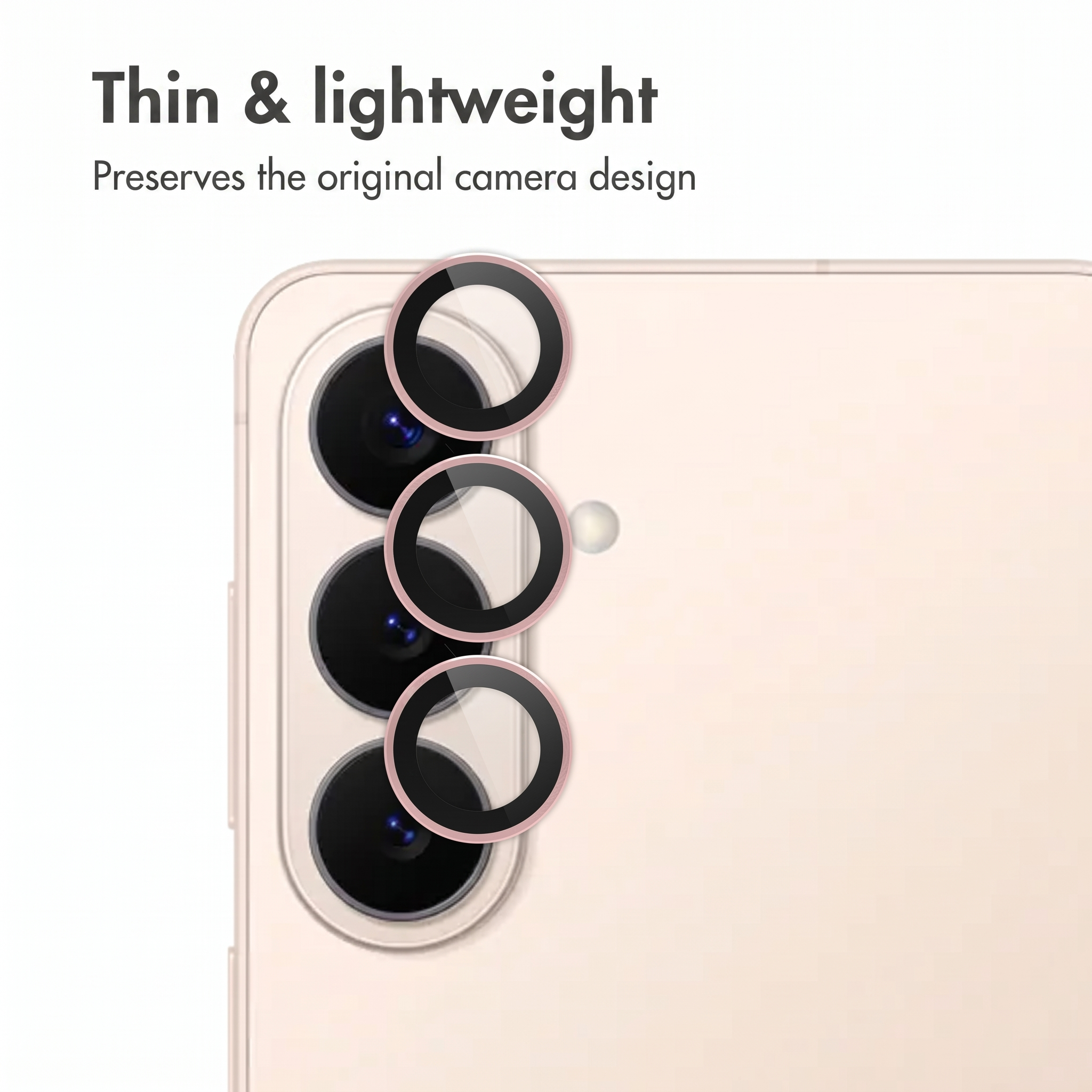 Primo piano della fotocamera di uno smartphone con tre anelli protettivi rosa e testo.