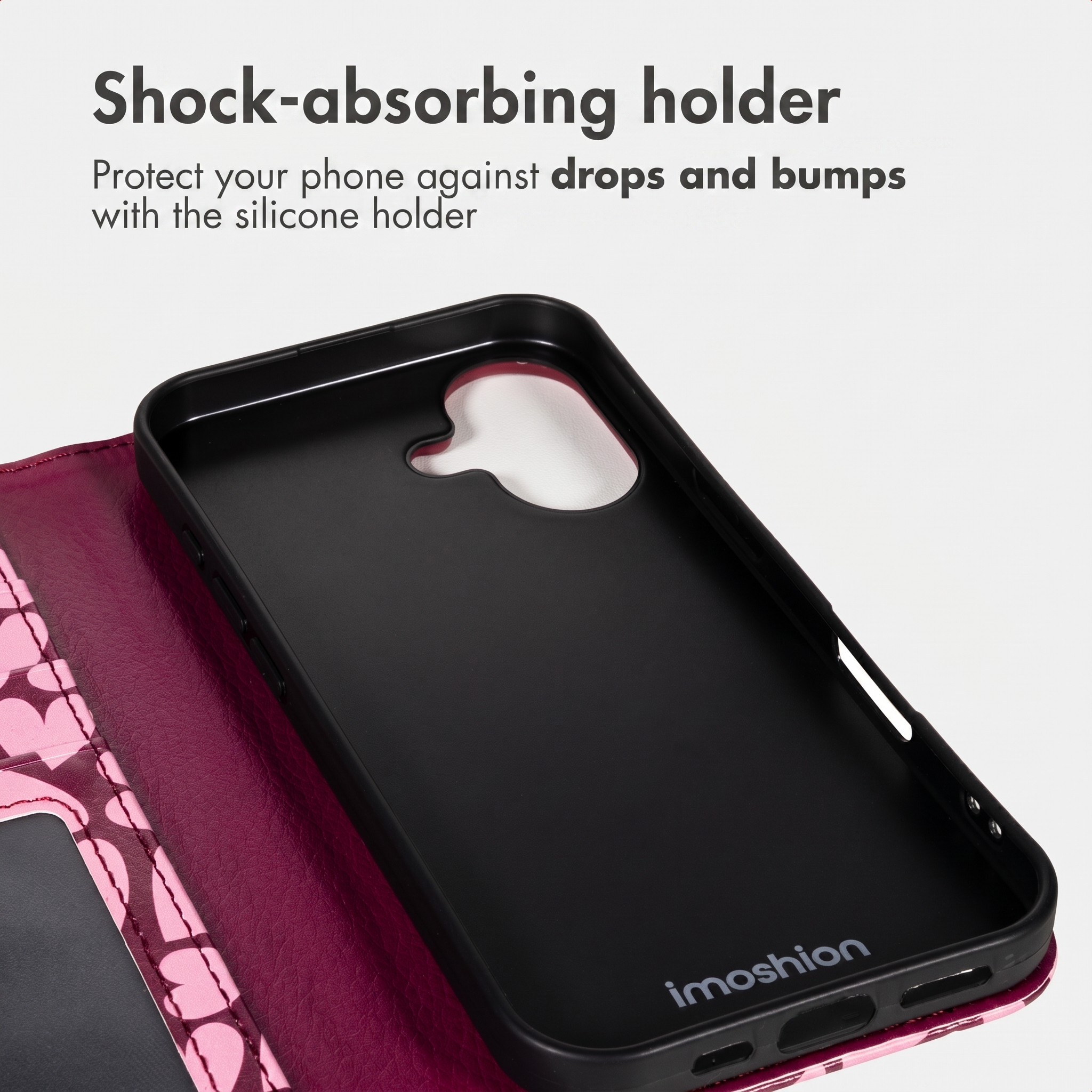 Ein pinkes Flip-Handycover mit schwarzer Silikonhalterung und Text oben.