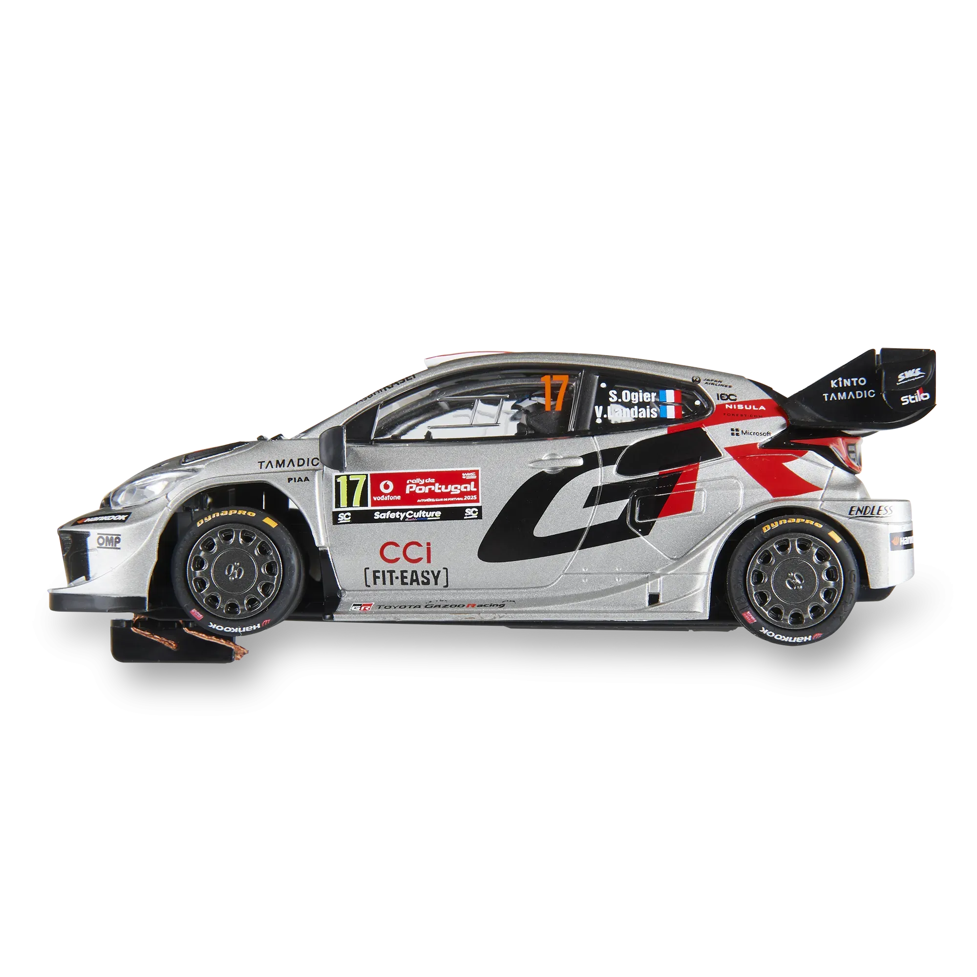 Coche modelo Toyota Gazoo Racing en plata y negro con rotulación S. Ogier sobre fondo negro.
